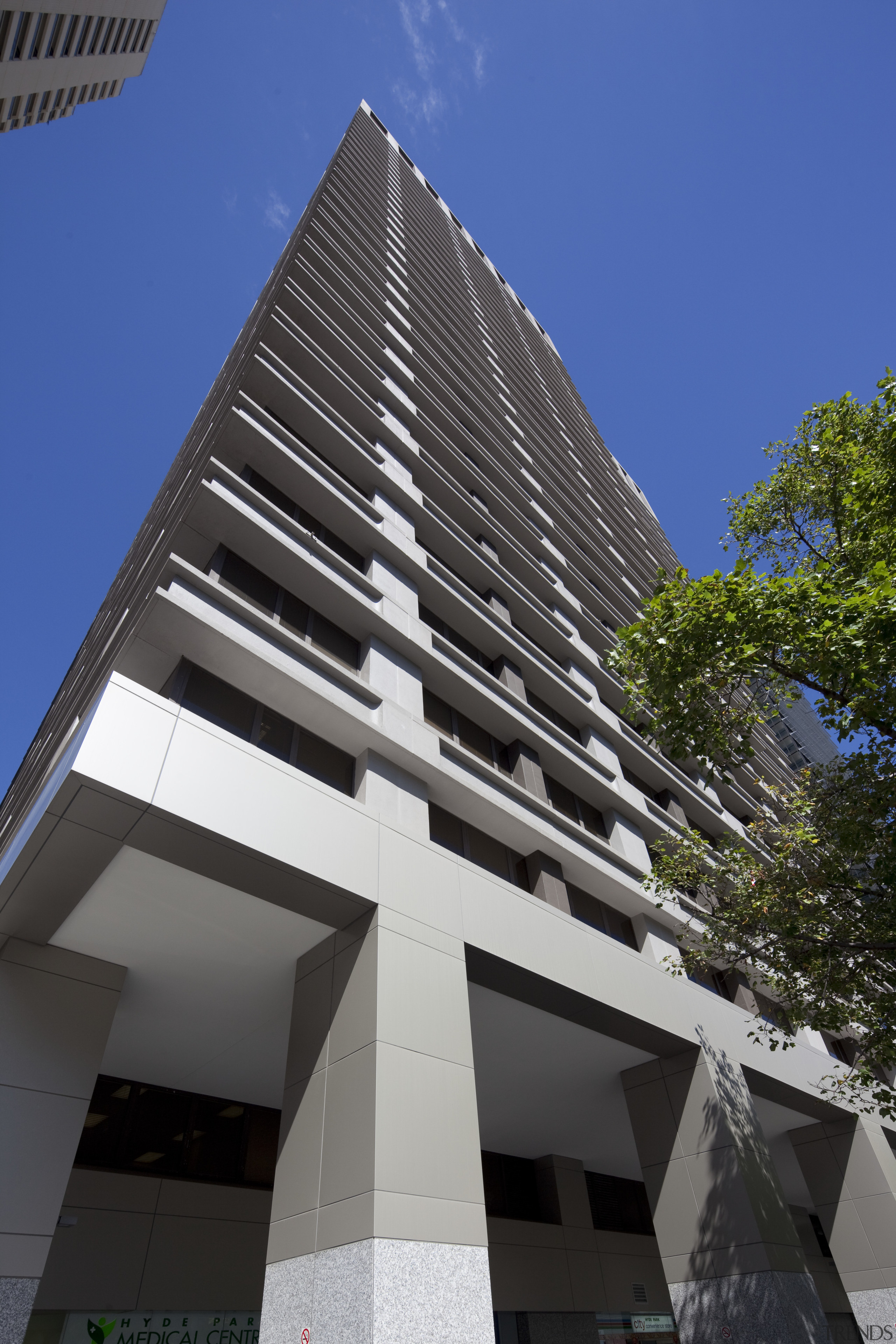 View of high rise office tower with wooden apartment, architecture, brutalist architecture, building, commercial building, condominium, corporate headquarters, daytime, facade, headquarters, house, landmark, metropolis, metropolitan area, mixed use, real estate, residential area, sky, skyscraper, tower block, black, blue