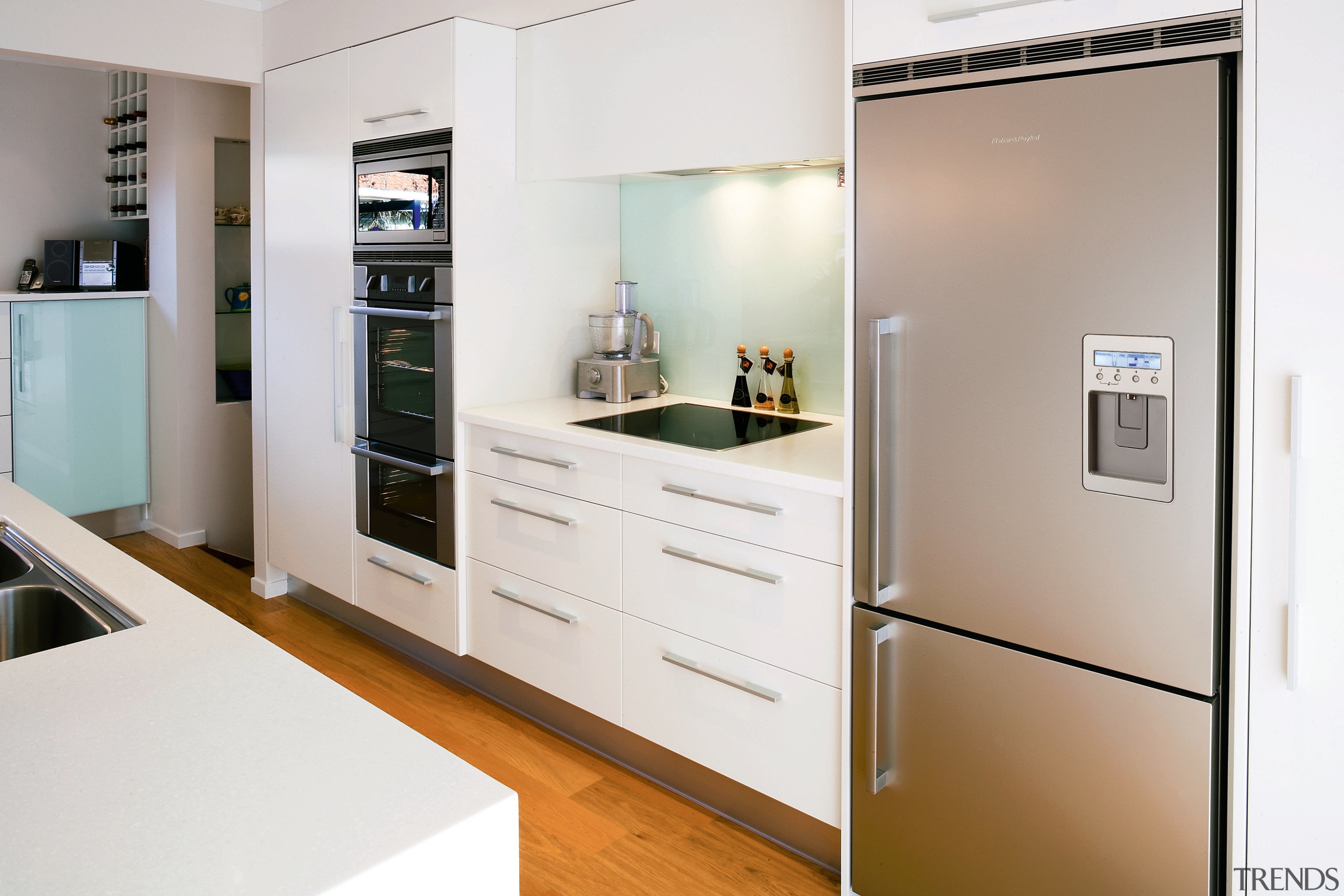 White kitchen with stainless steel refrigerator. - White countertop, home appliance, interior design, kitchen, major appliance, room, white