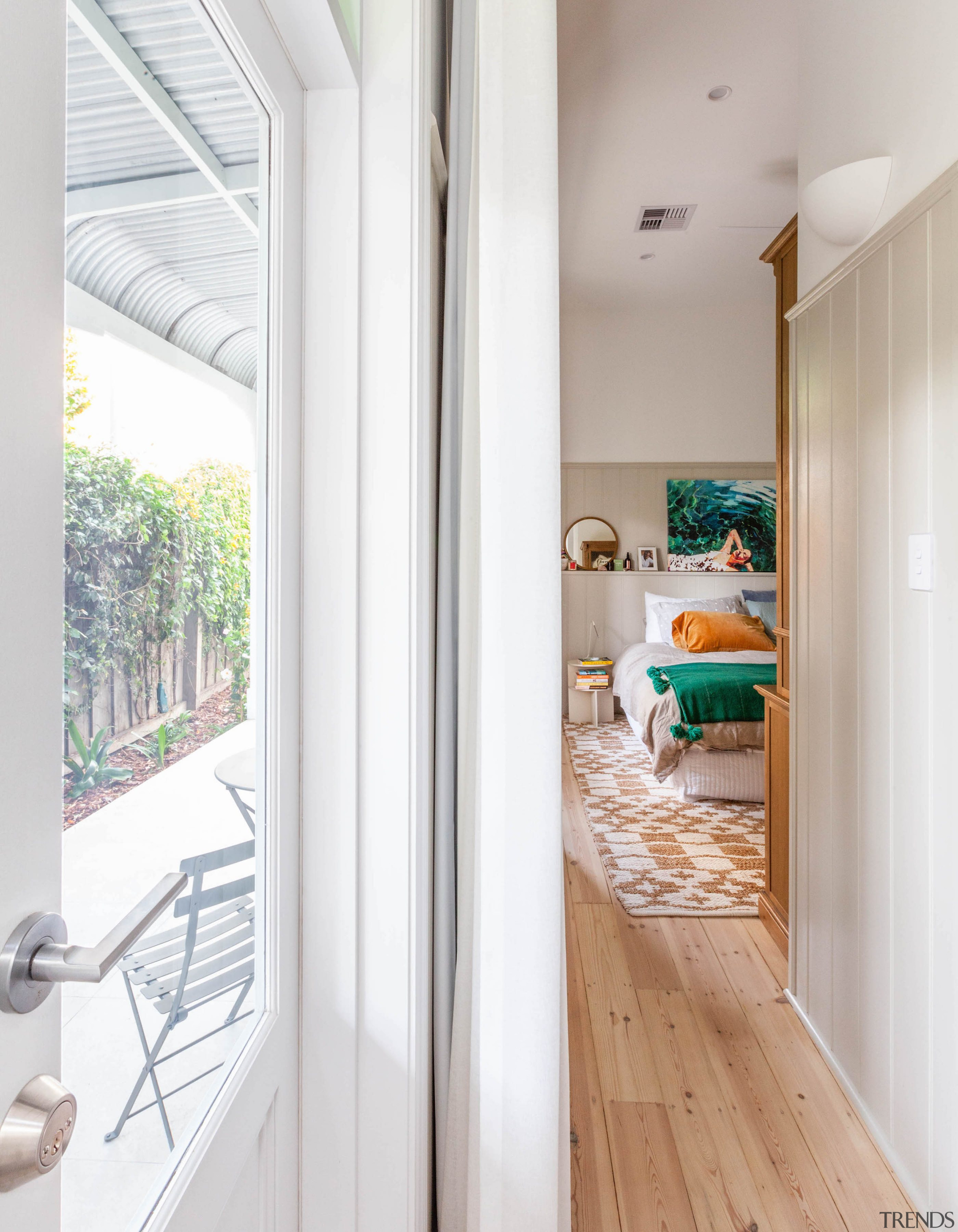 The master bedroom opens, via a matching pair 