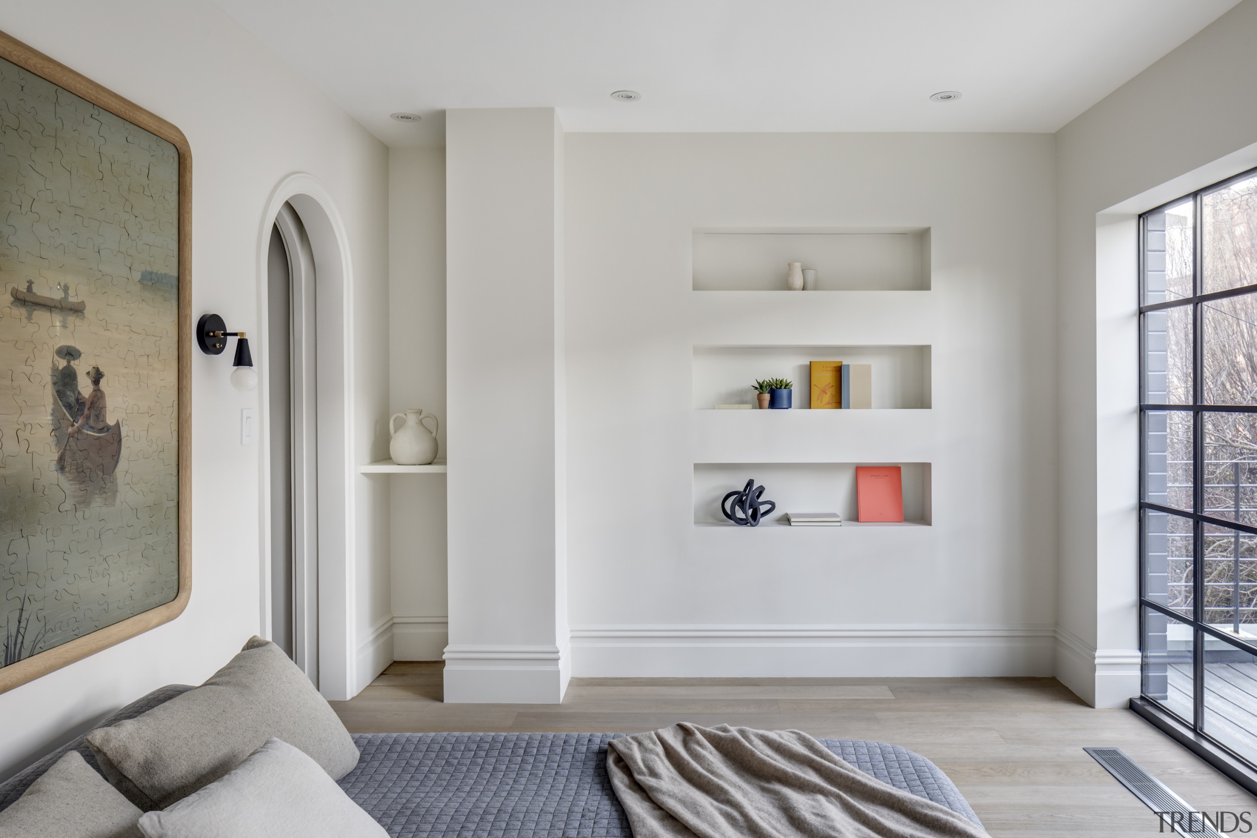 This bedroom opens onto a balcony through steel 