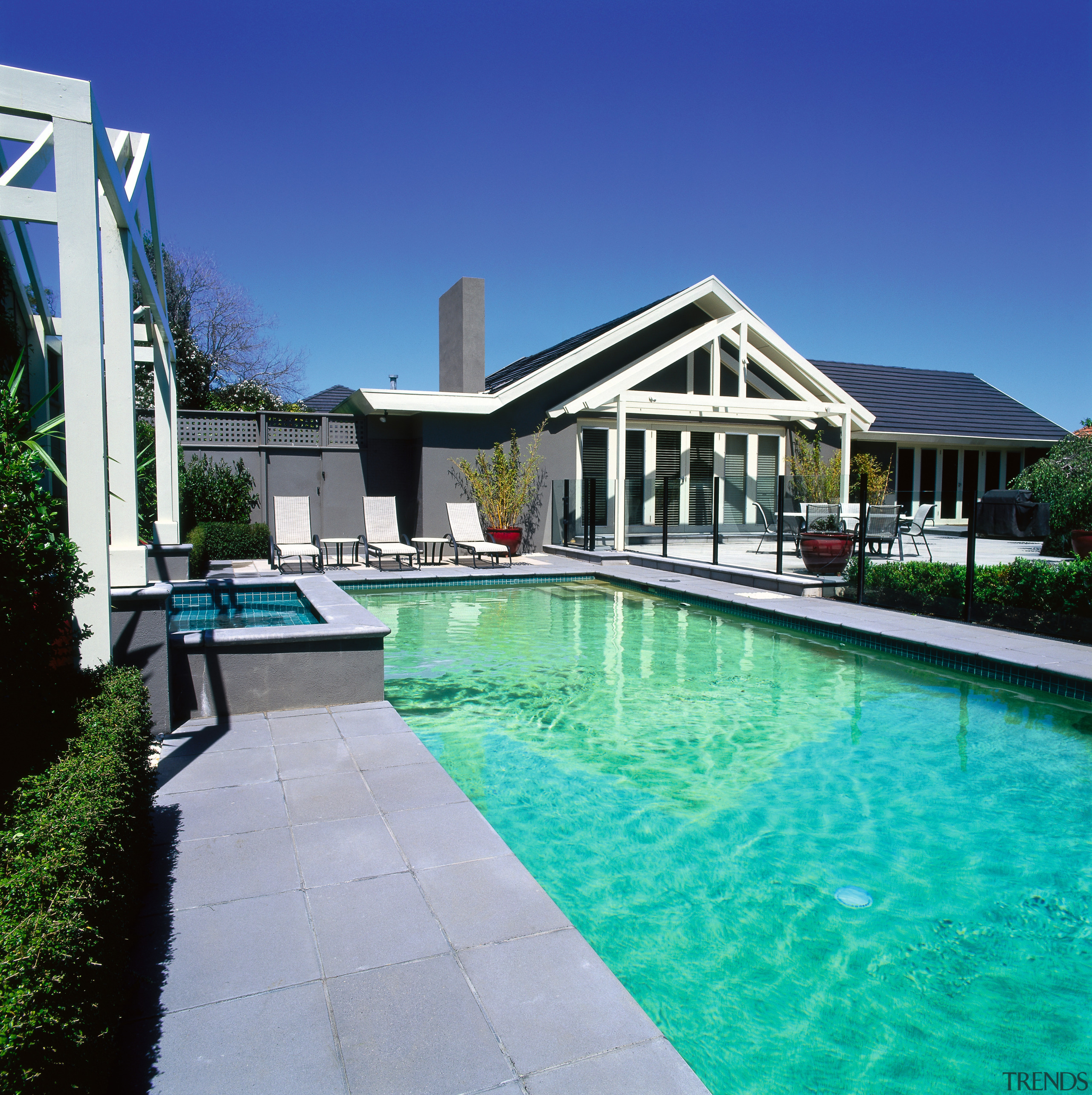 Landscape renovation. Rectangular swimming pool, pergola over the backyard, estate, home, house, leisure, mansion, property, real estate, residential area, resort, sky, swimming pool, villa, water, blue