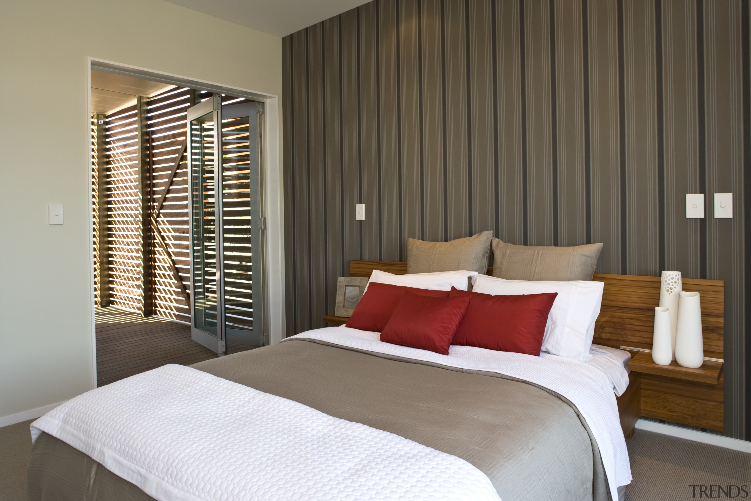 Each bedroom in the showhome features a patterned bed frame, bedroom, curtain, home, interior design, real estate, room, suite, wall, window, window blind, window covering, window treatment, wood, brown, gray