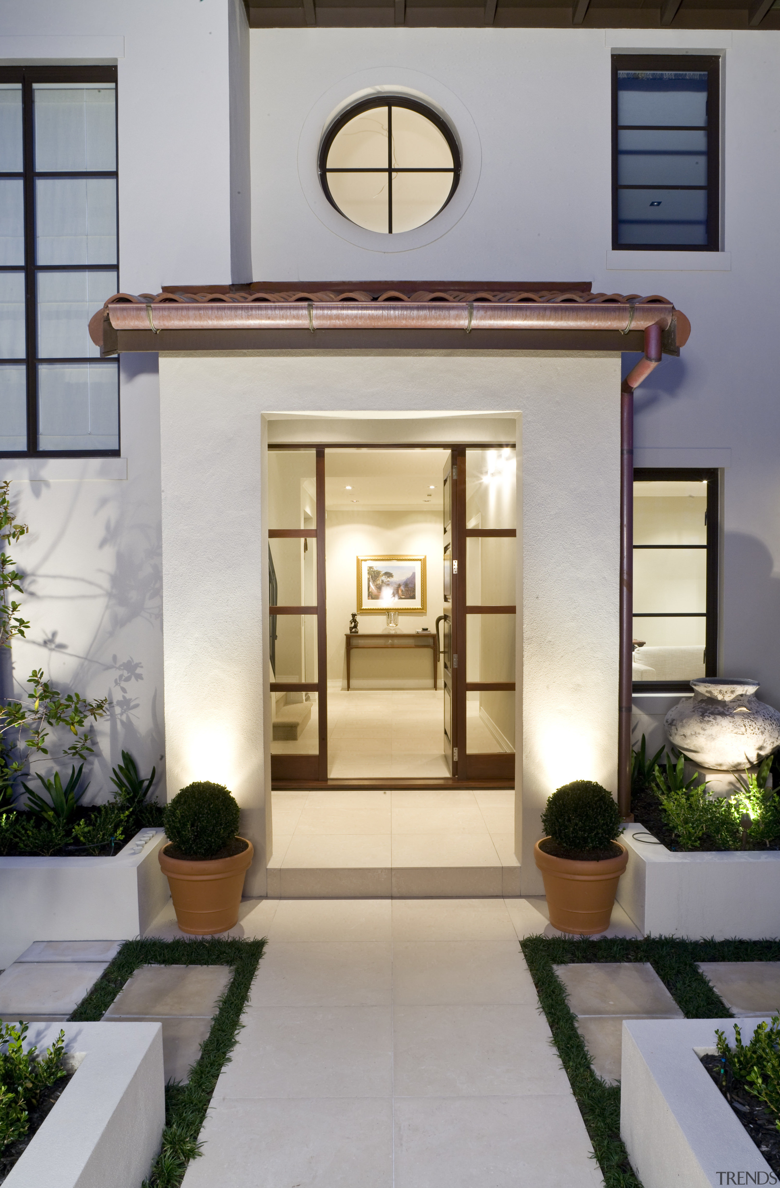 Exterior view of a Mediterranean-style house built by door, home, interior design, real estate, gray