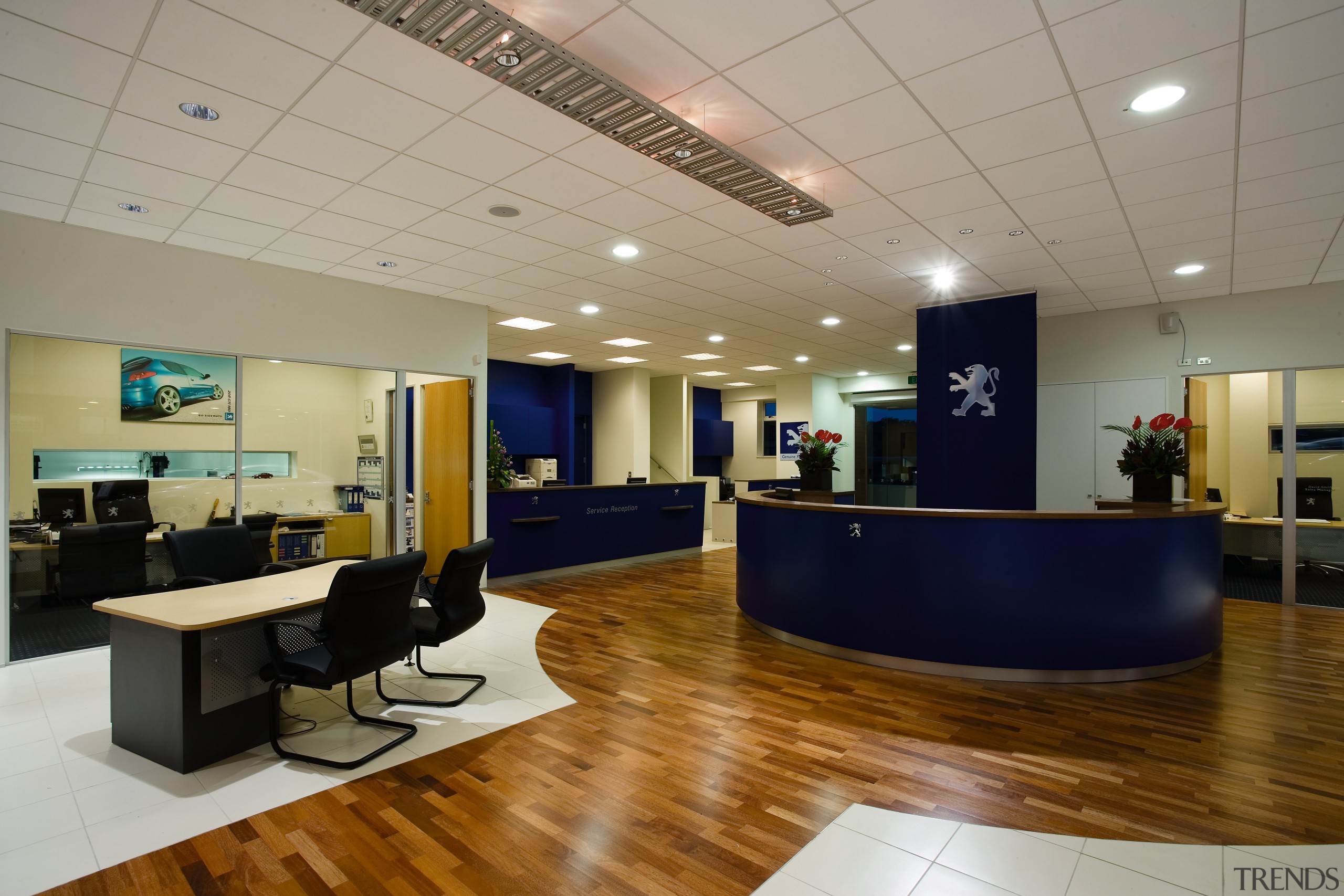 A view of the Puergot showroom. - A ceiling, floor, institution, interior design, lobby, office, gray, brown