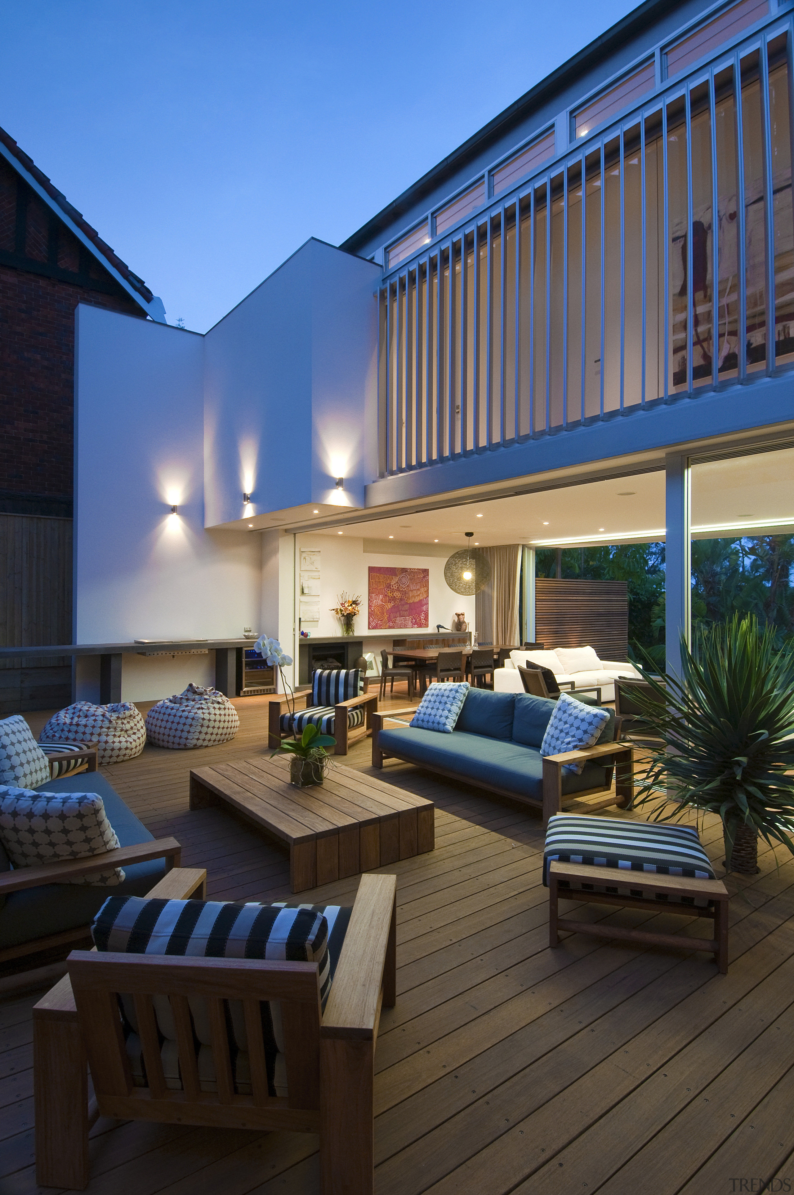 View of wooden deck with outdoor furniture. - apartment, balcony, estate, home, house, interior design, living room, patio, penthouse apartment, property, real estate, resort, roof, window, black