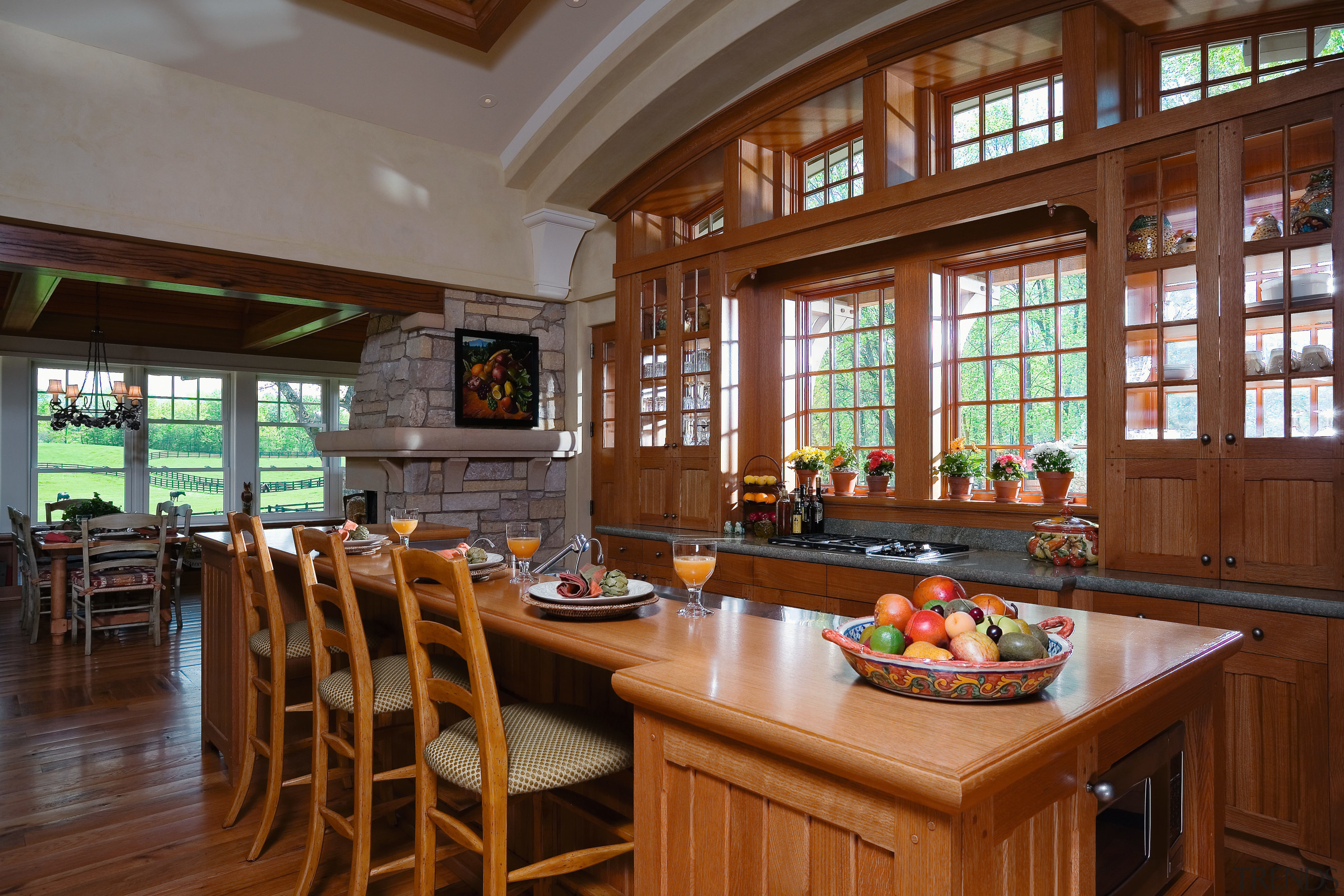 The kitchen and ajacent porch have a relaxed, countertop, dining room, estate, home, interior design, kitchen, real estate, room, window, brown