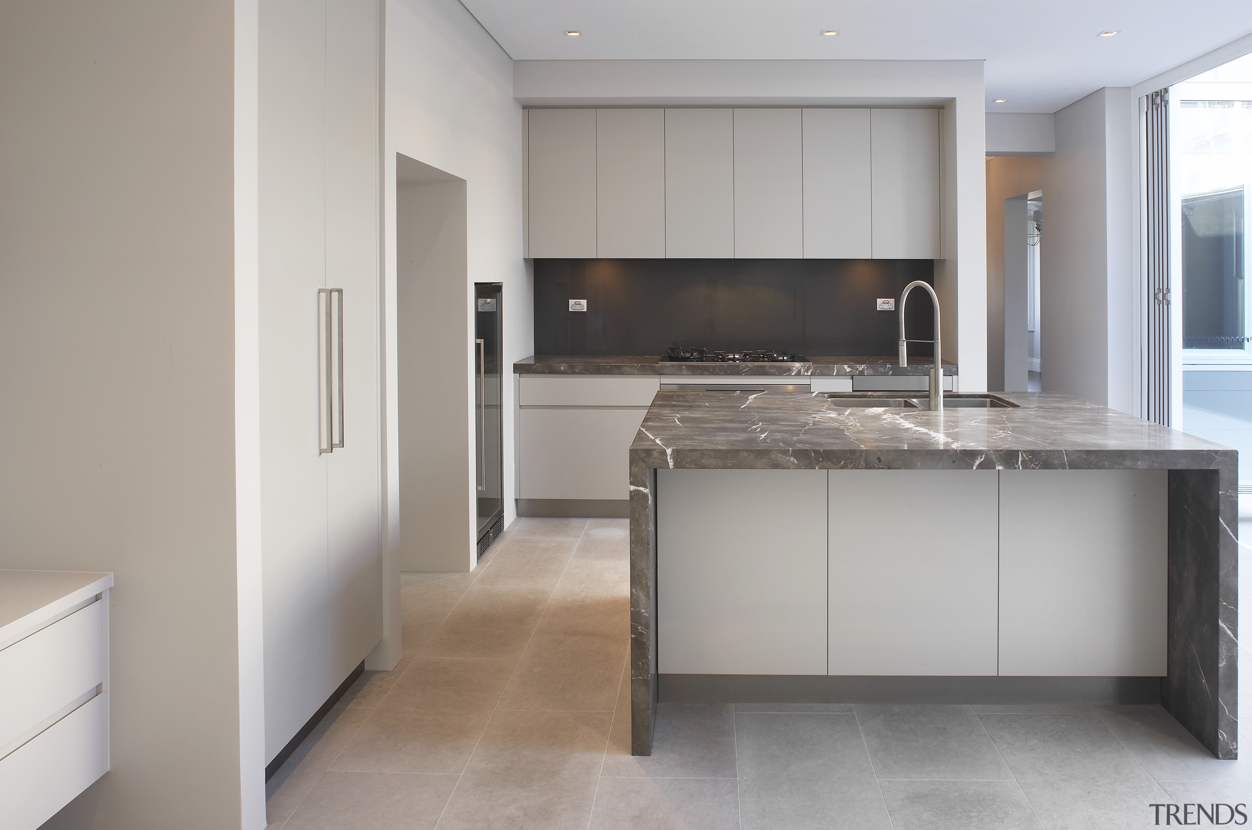 Grey and brown marble island benchtop, white walls, cabinetry, countertop, cuisine classique, floor, flooring, interior design, kitchen, real estate, room, wood flooring, gray