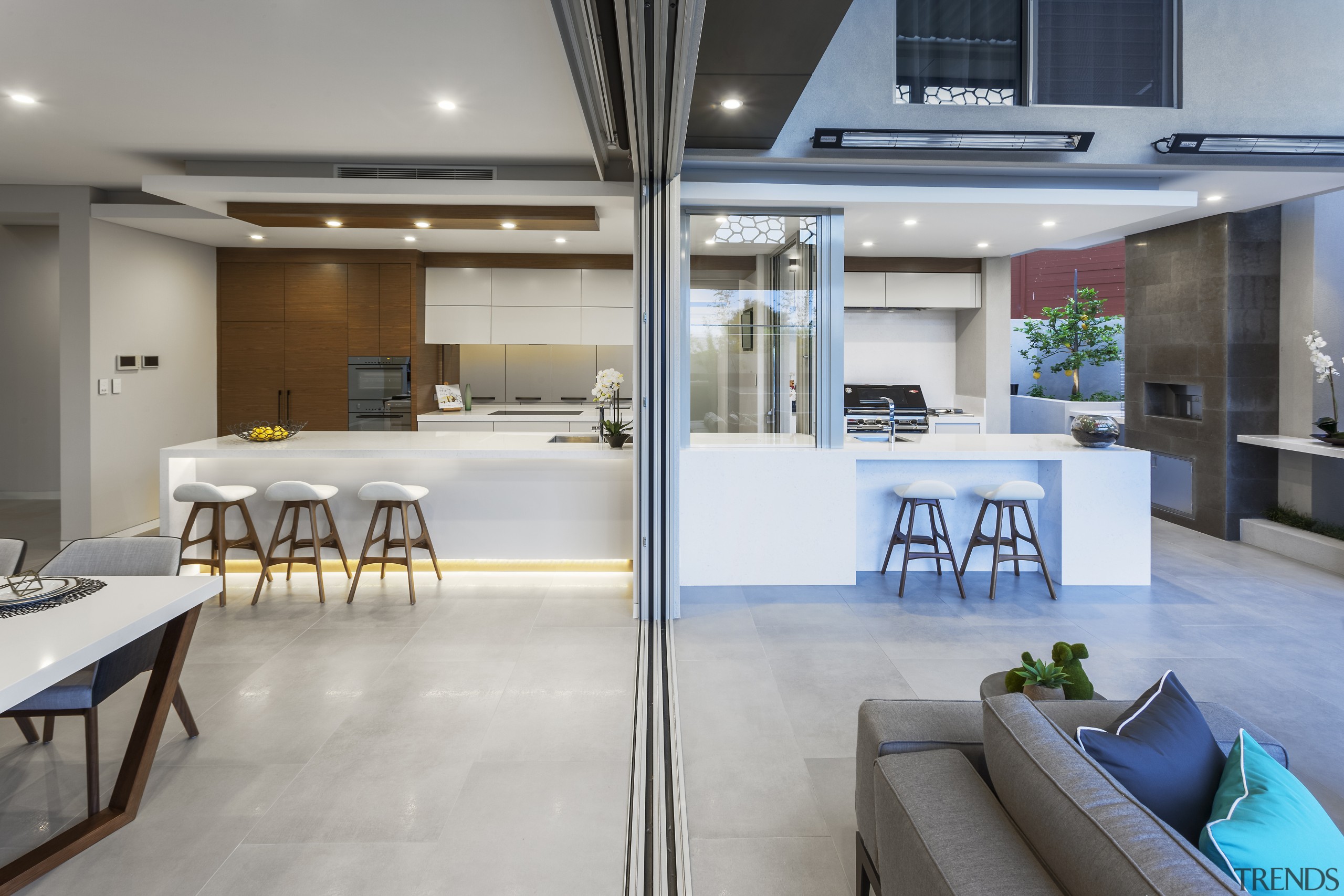 ​​​​​​​A dropped ceiling delineates the indoor kitchen in interior design, gray