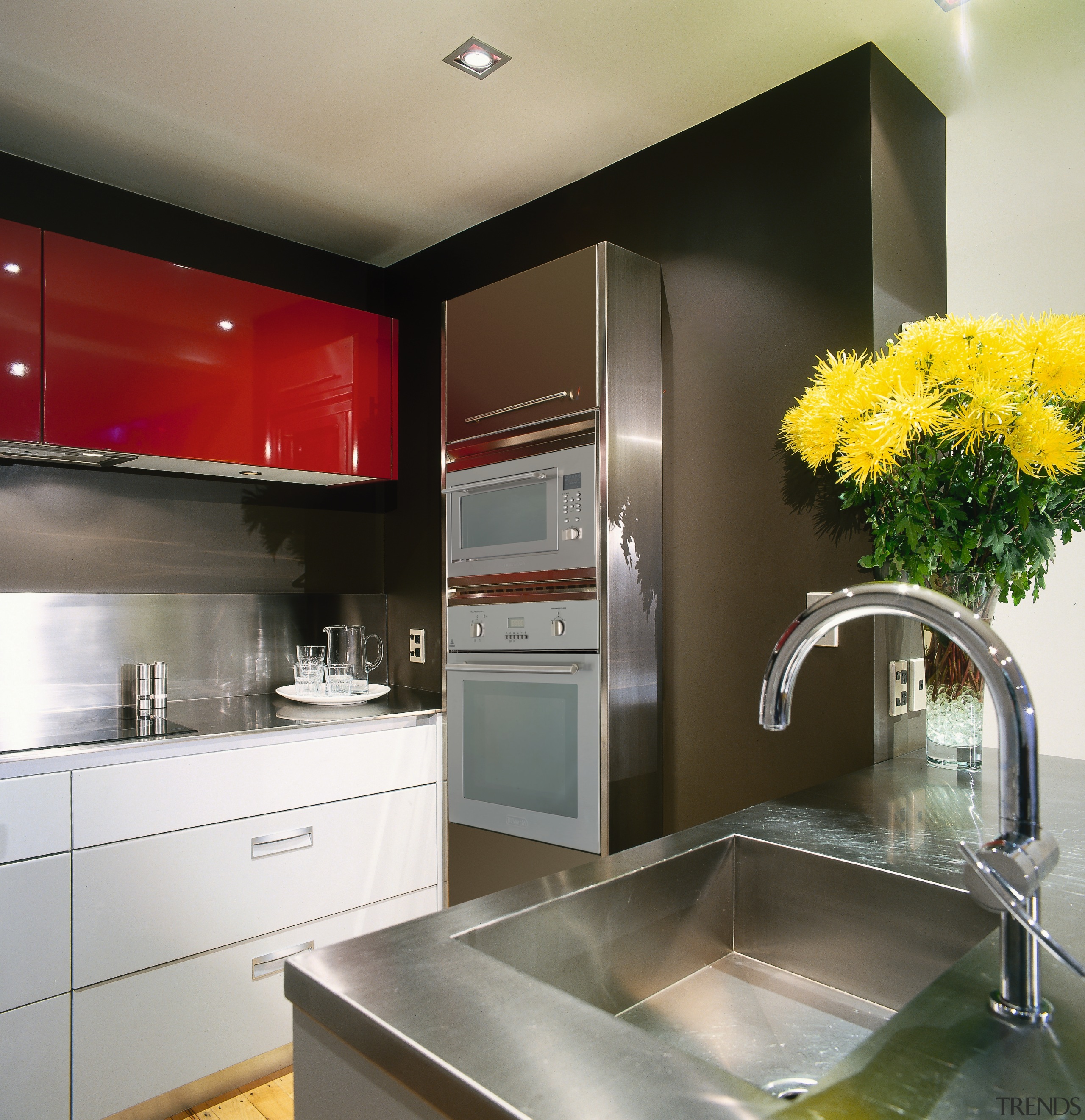 A view of a kitchen, grye and red cabinetry, countertop, interior design, kitchen, gray