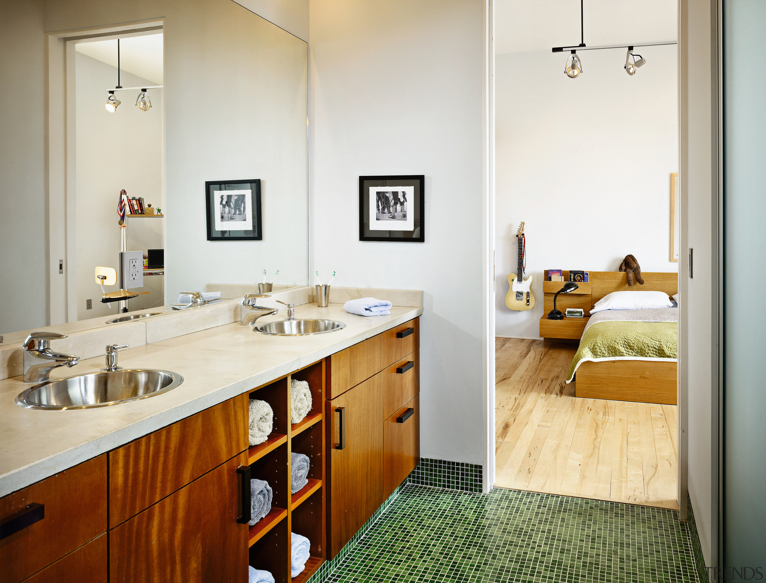 view of the bathroom featuring timber veneer cabinetry, bathroom, countertop, floor, home, interior design, room, white