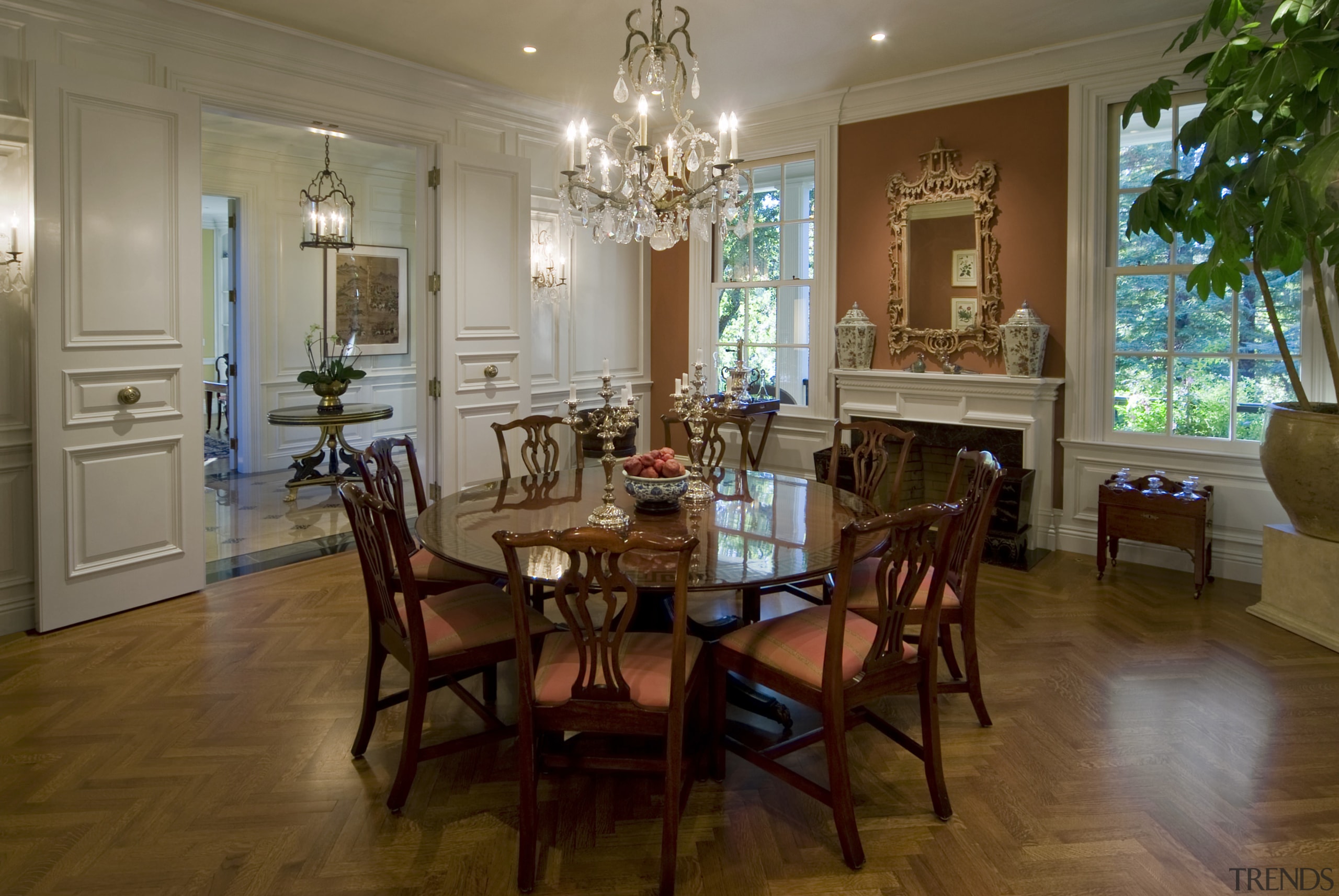 View of dining area with circular table. - dining room, estate, floor, flooring, hardwood, home, house, interior design, living room, real estate, room, table, wood, wood flooring, brown