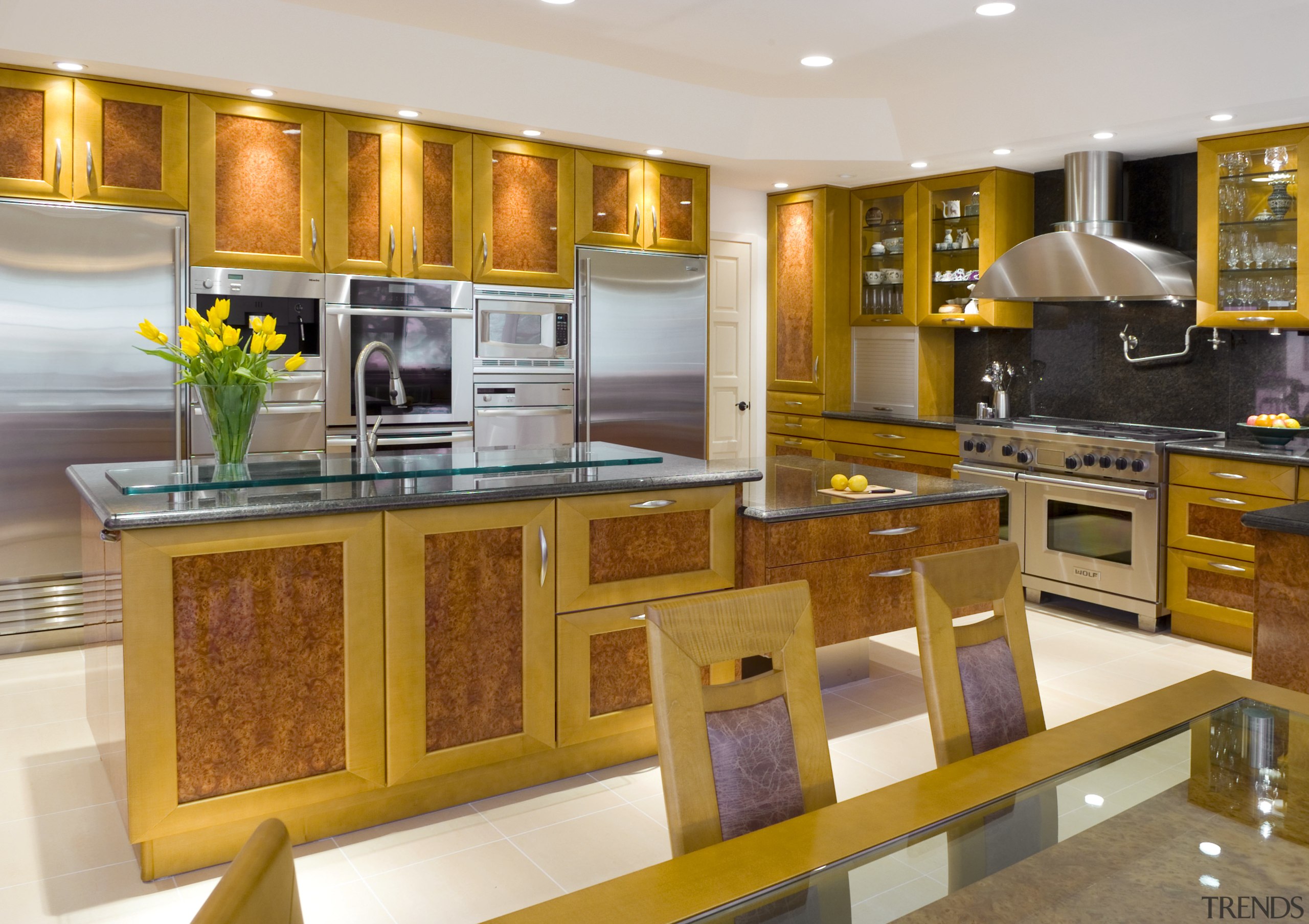 view of kitchen including cabinetry, granite countertops, tile cabinetry, countertop, cuisine classique, interior design, kitchen, room, brown, white