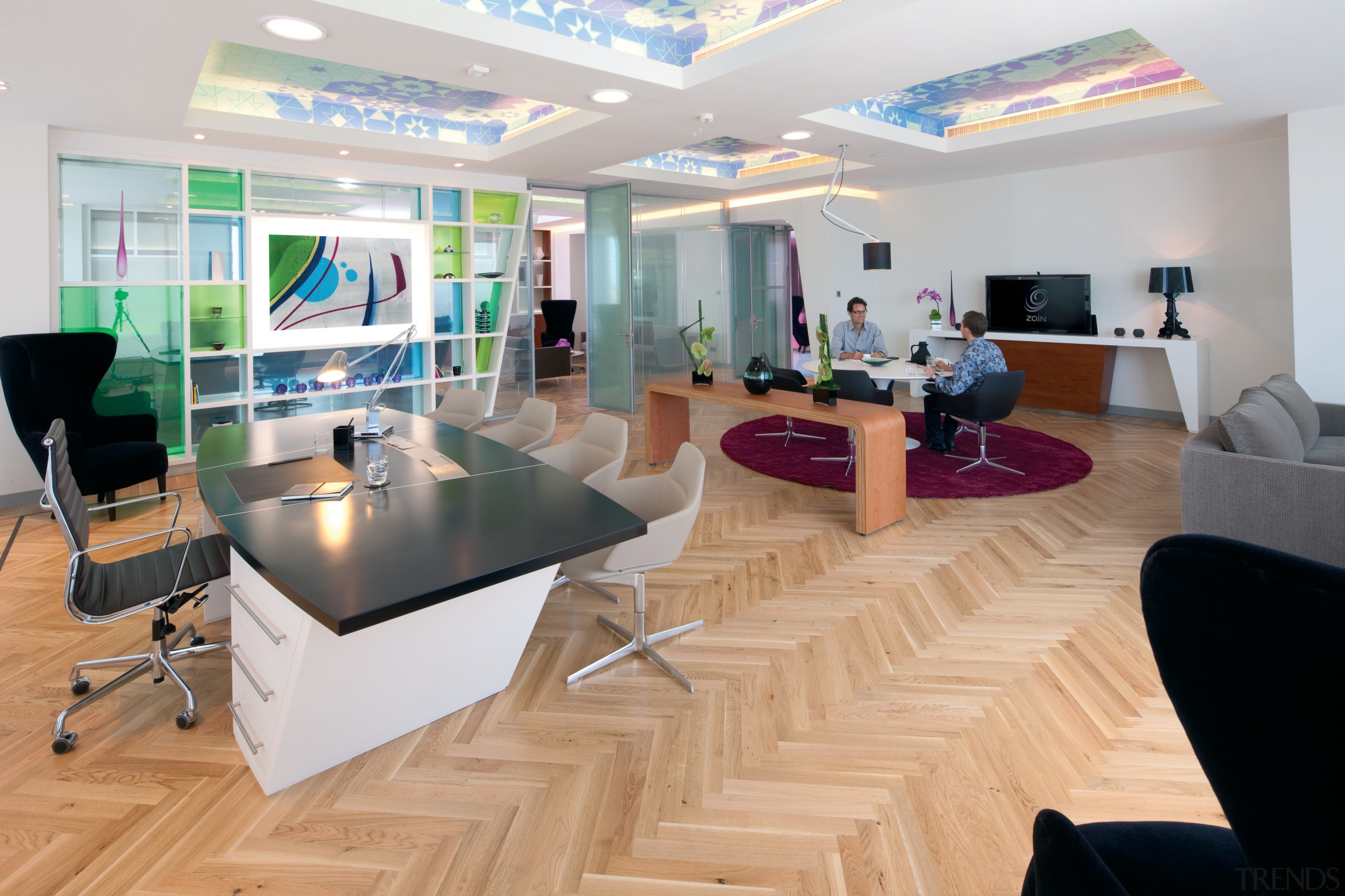 The new Zain headquarters in Bahrain reflects the floor, flooring, interior design, lobby, gray, orange