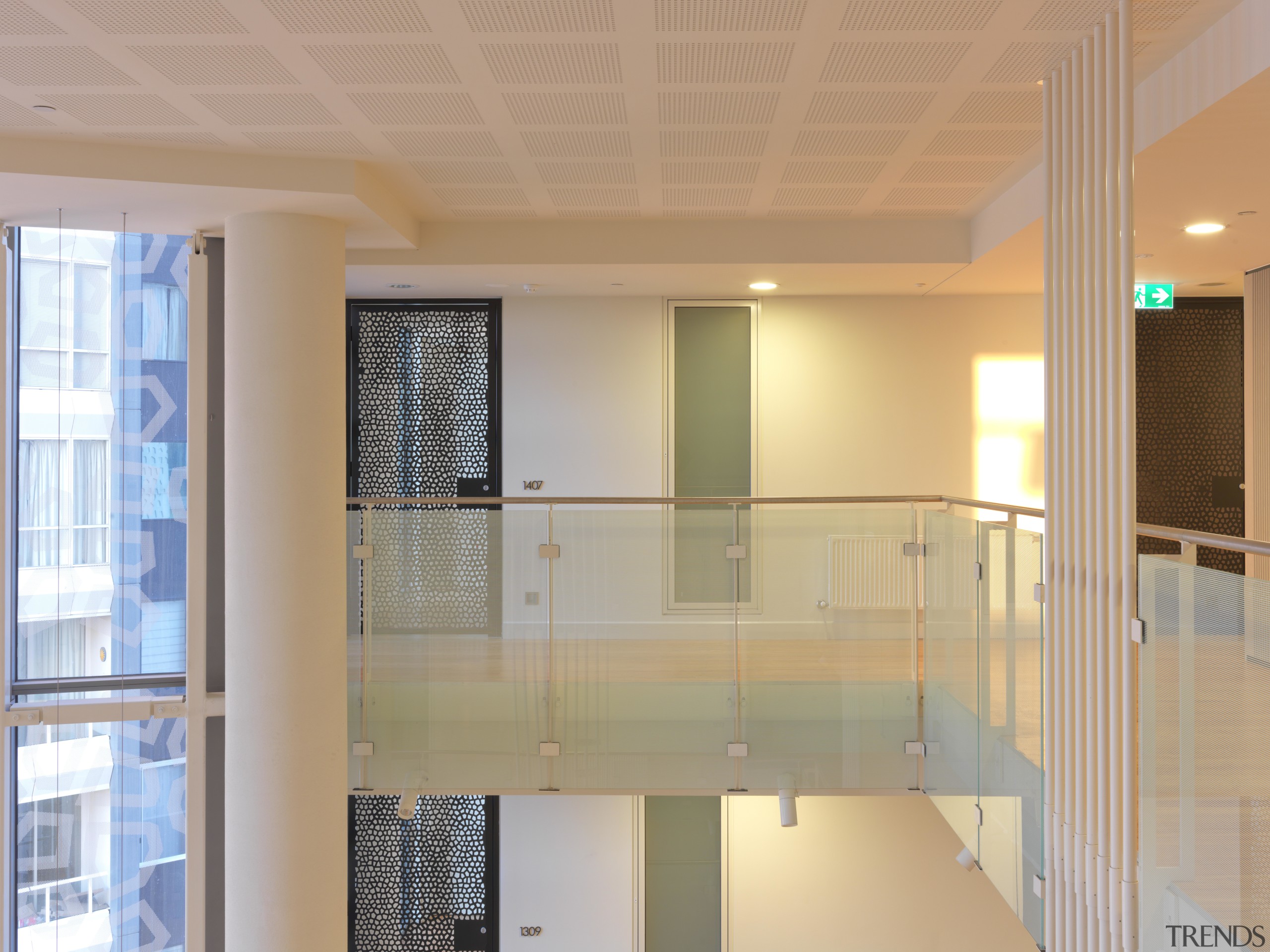 View of interior balcony at the Tripych residential apartment, architecture, ceiling, daylighting, floor, flooring, glass, home, interior design, lobby, real estate, window, orange, gray