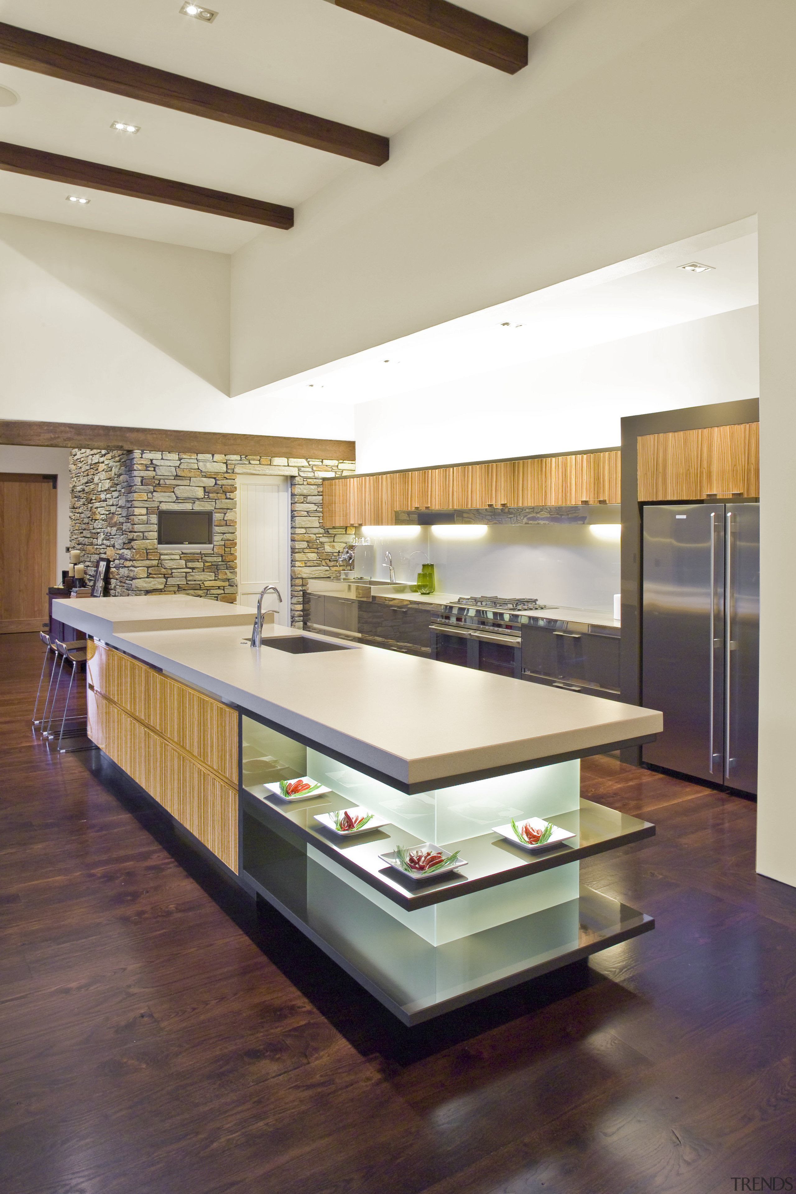 View of a kitchen which features ovens, refrigerator, cabinetry, countertop, cuisine classique, daylighting, floor, flooring, hardwood, interior design, kitchen, laminate flooring, real estate, wood, wood flooring, white