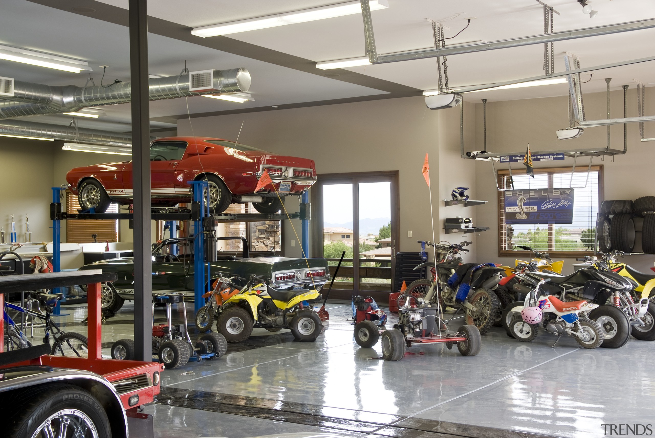 View of the garage which features exterior windows automobile repair shop, car, motor vehicle, vehicle, gray