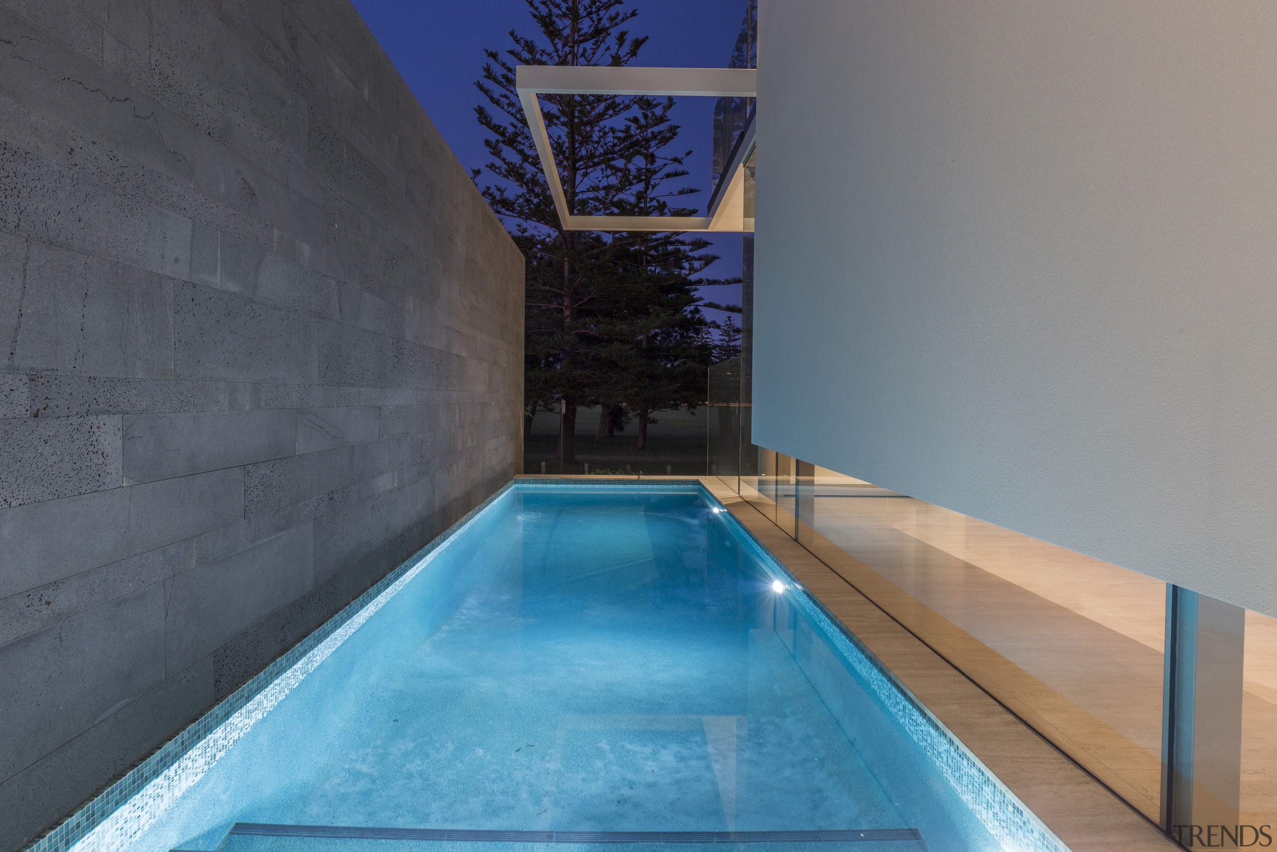 A plunge pool nestled between the building and 