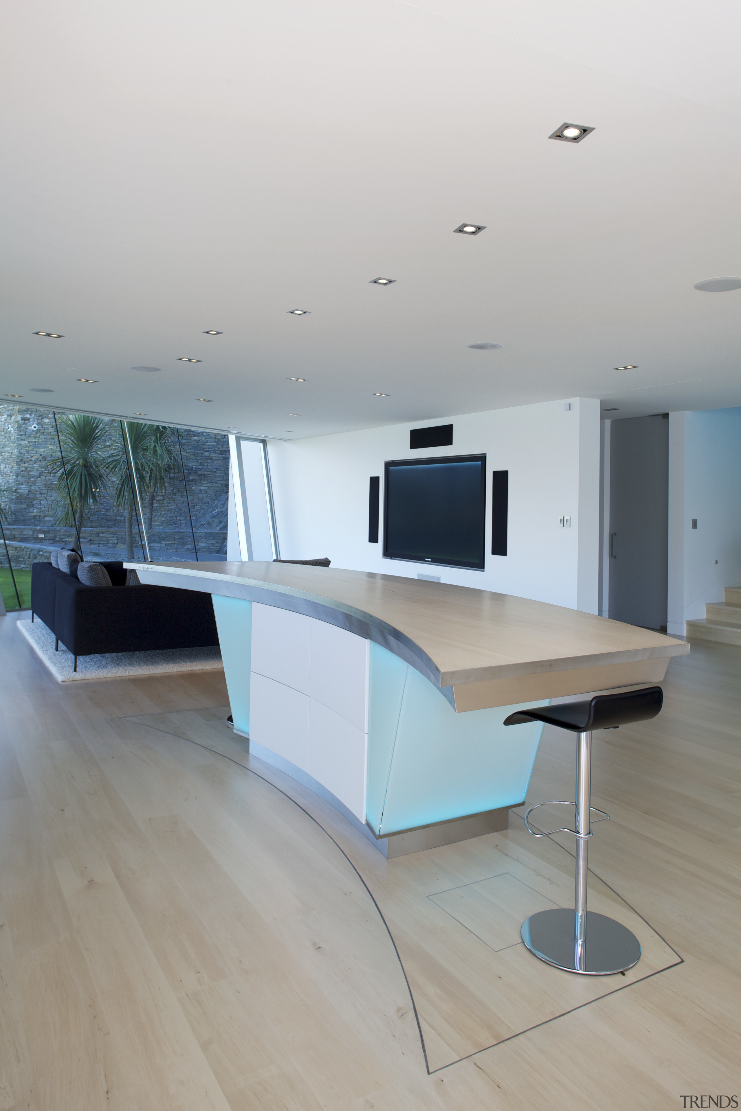 An island bar in this large mountain home architecture, chair, daylighting, desk, floor, flooring, furniture, house, interior design, product design, table, gray