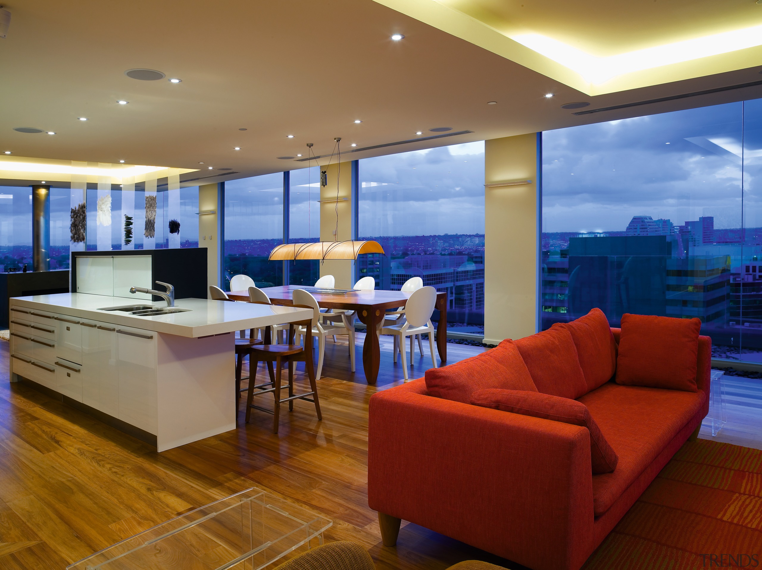 A view of the kitchen and dining area apartment, architecture, ceiling, floor, interior design, living room, penthouse apartment, real estate, brown