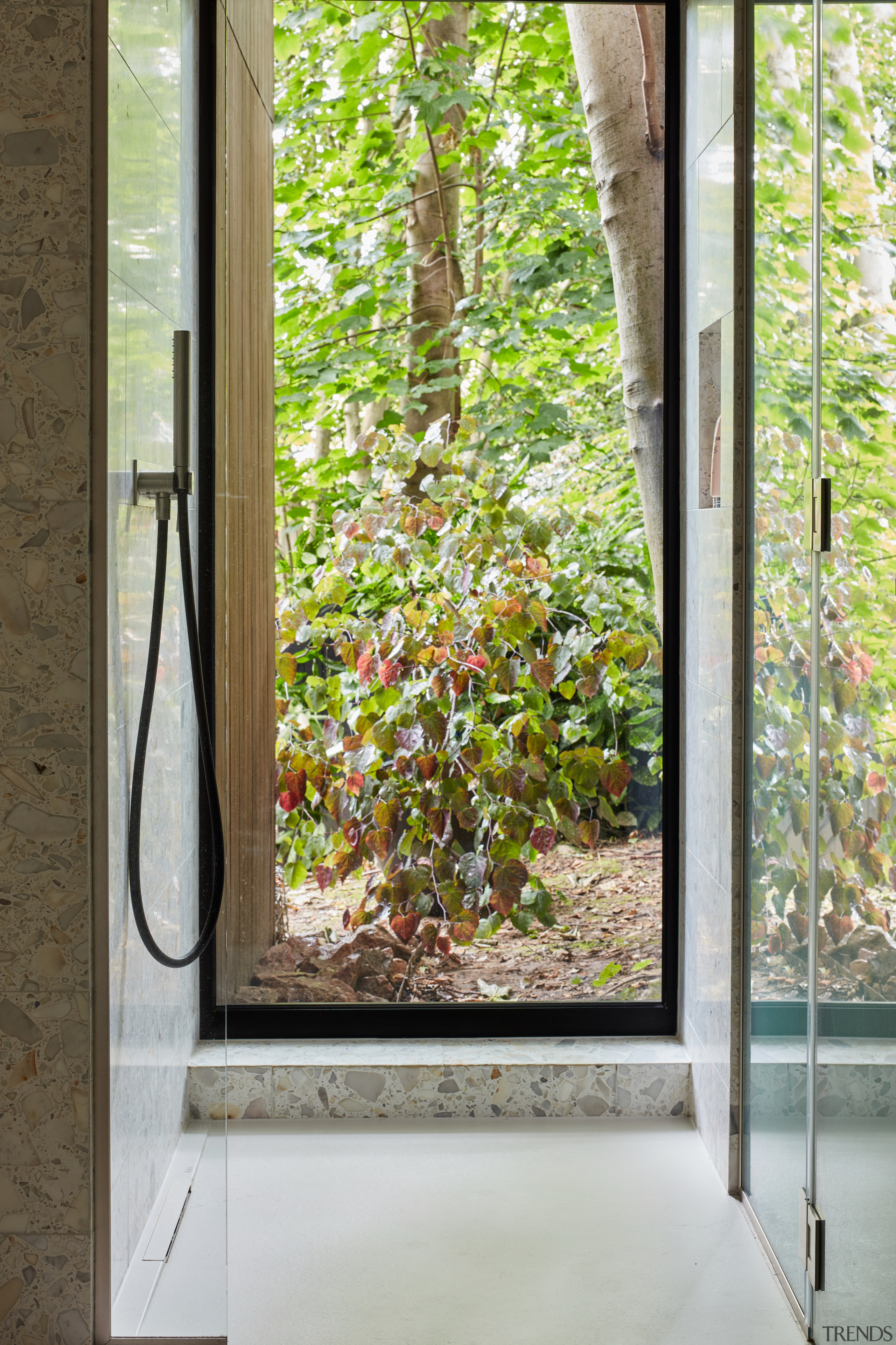 Even the shower stall connects with the leafy 