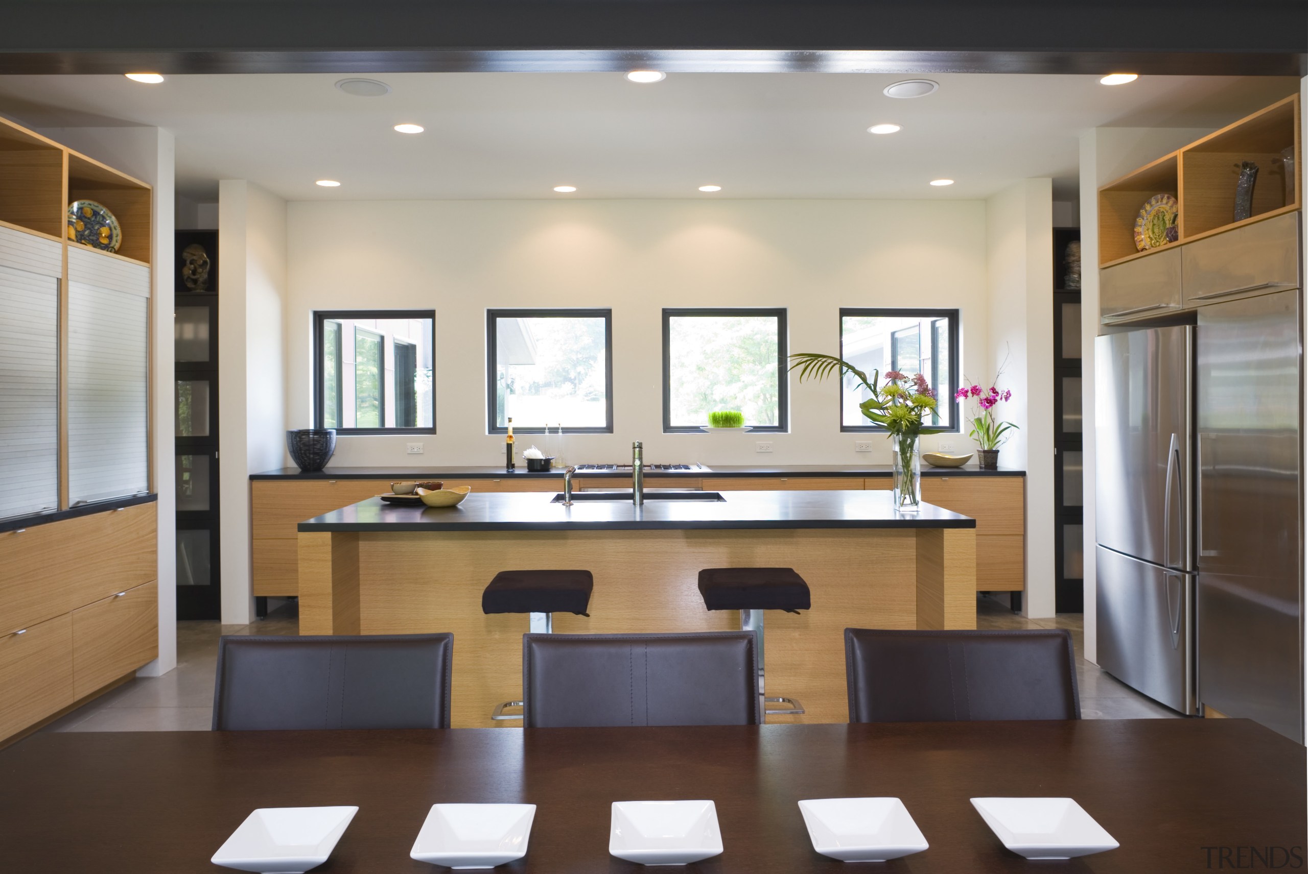 A sence of balance is created through the conference hall, furniture, interior design, kitchen, room, gray, brown