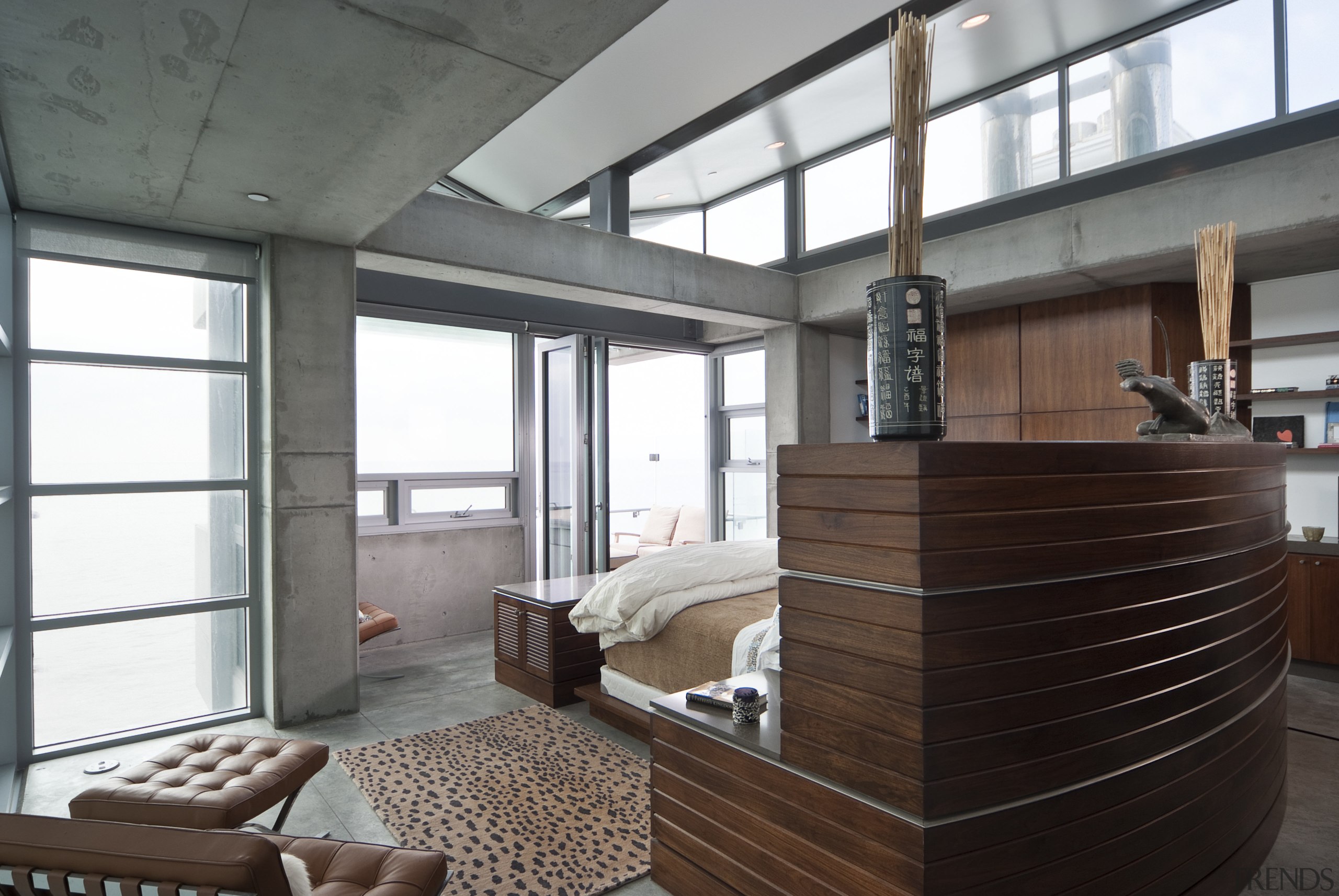 View of the master bedroom featuring concrete floors, architecture, furniture, house, interior design, window, gray, black, white