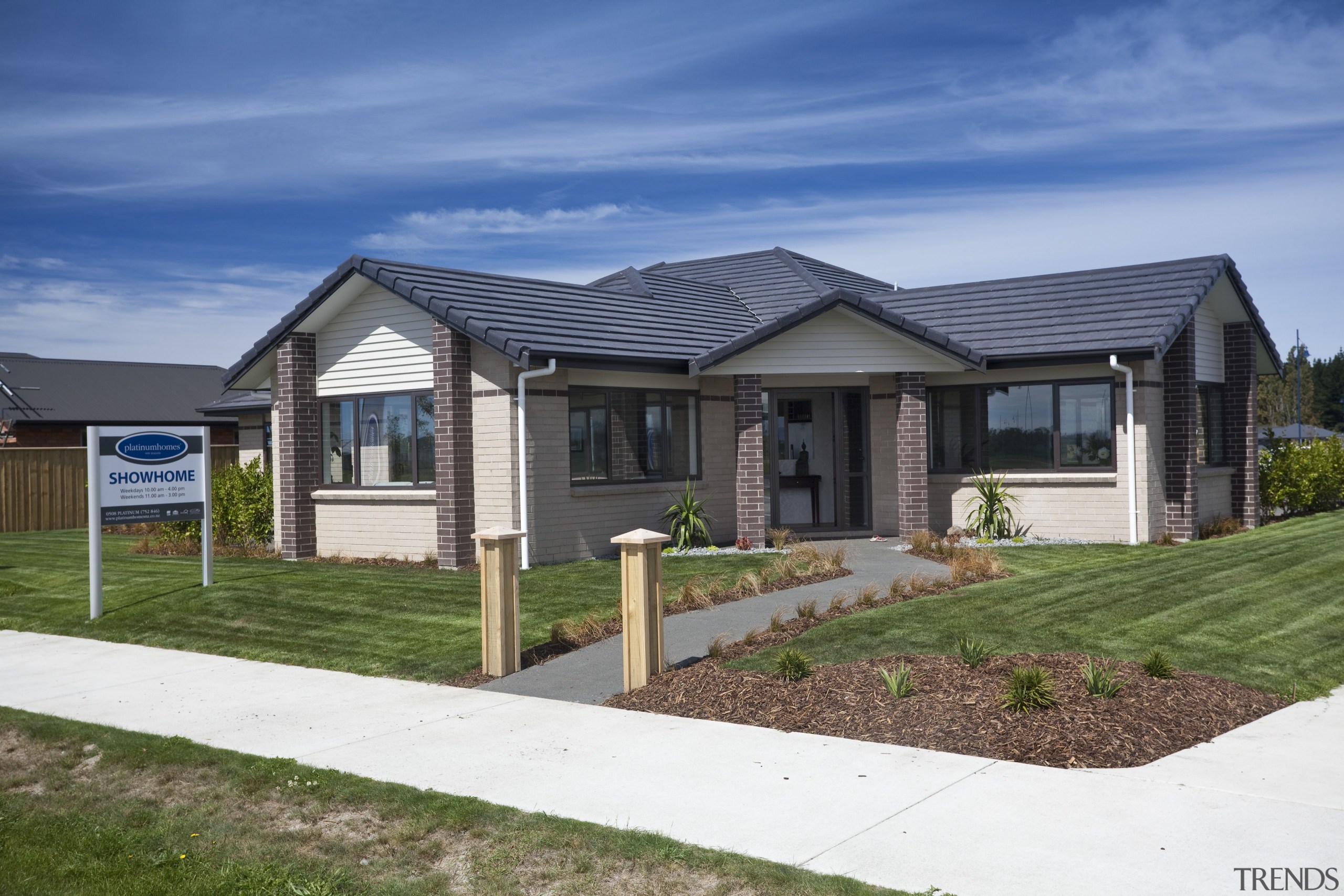 View of Platinum Homes show home with solid cottage, elevation, estate, facade, home, house, land lot, landscape, neighbourhood, property, real estate, residential area, siding, suburb, yard