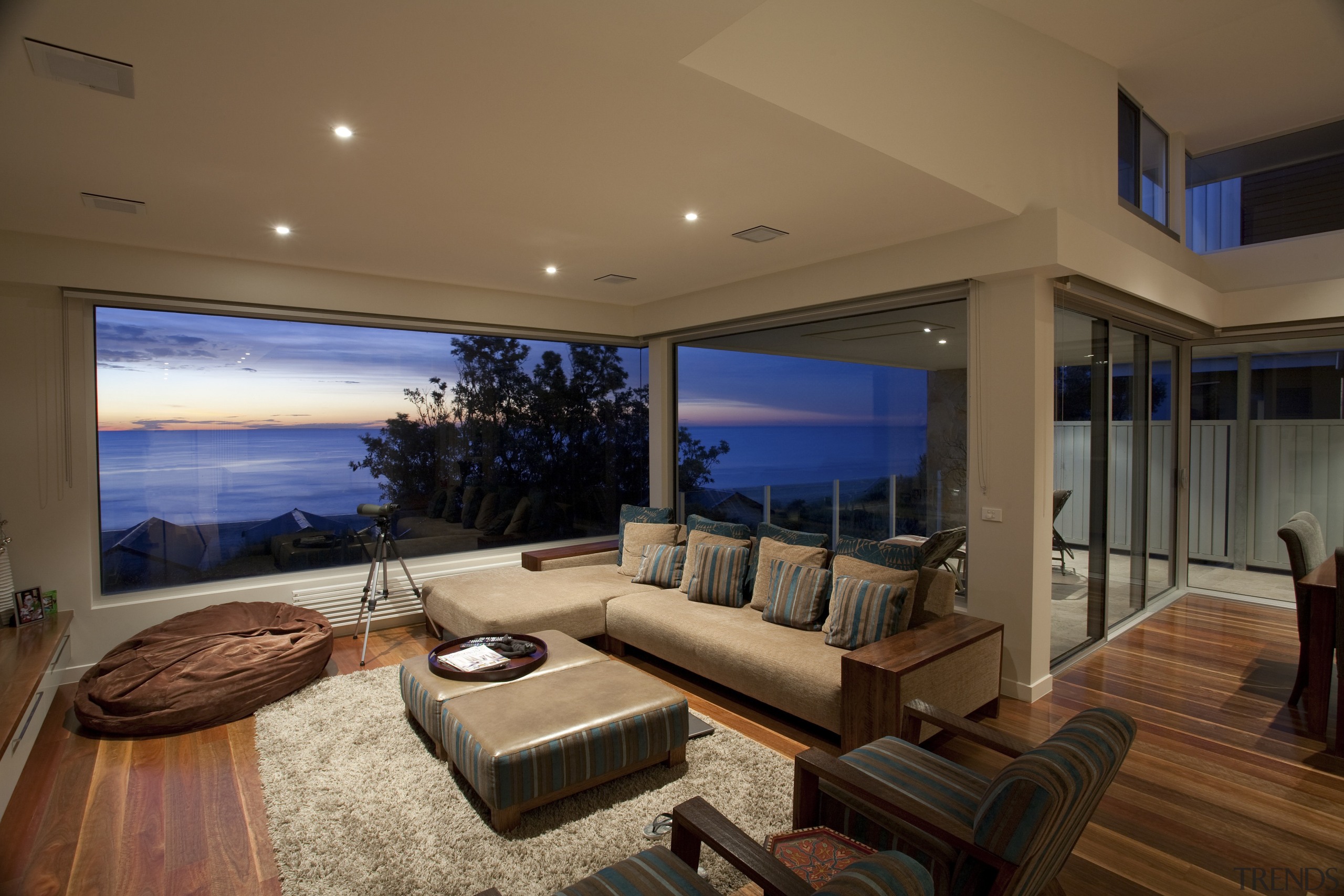 View of contemporary home with dark cabinetry, wooden apartment, ceiling, condominium, estate, home, house, interior design, living room, penthouse apartment, property, real estate, room, window, brown