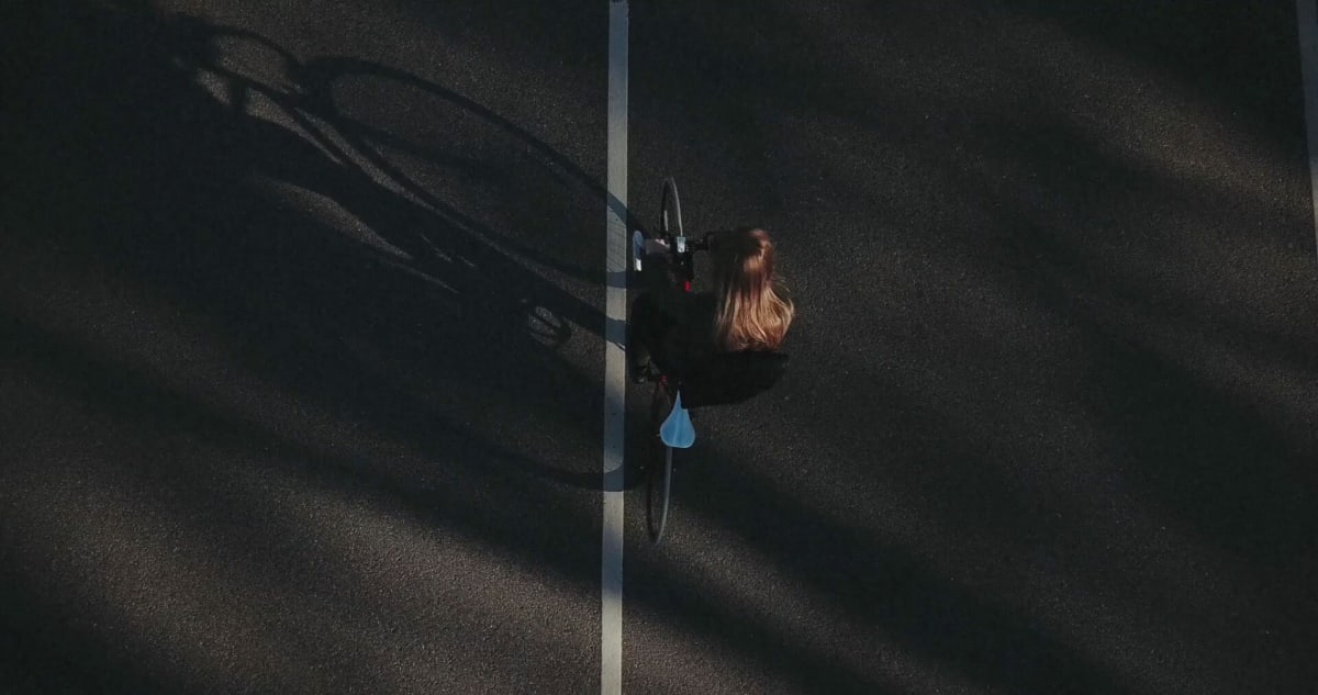 Overhead of person riding a bicycle