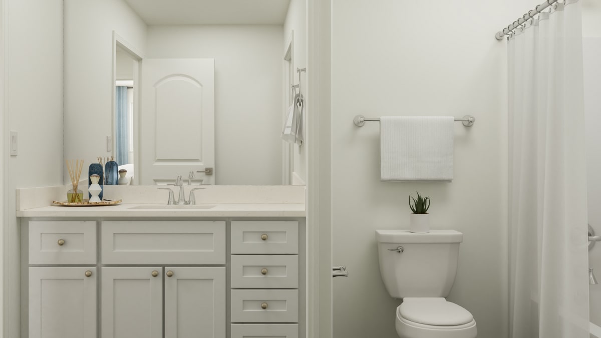View of second floor bathroom with vanity, sink, shower and toilet