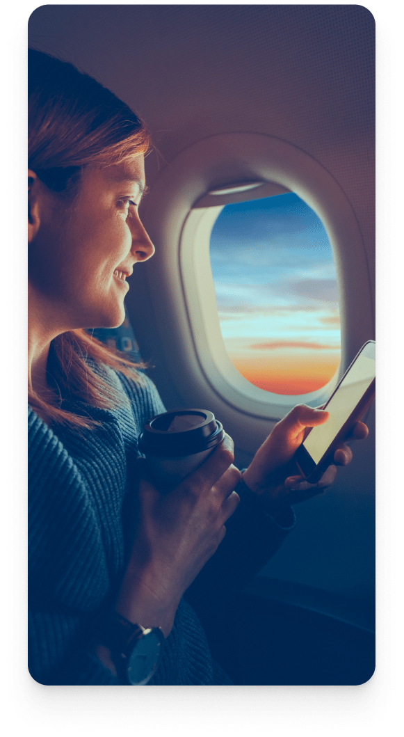 Picture of a woman looking out an airplane window