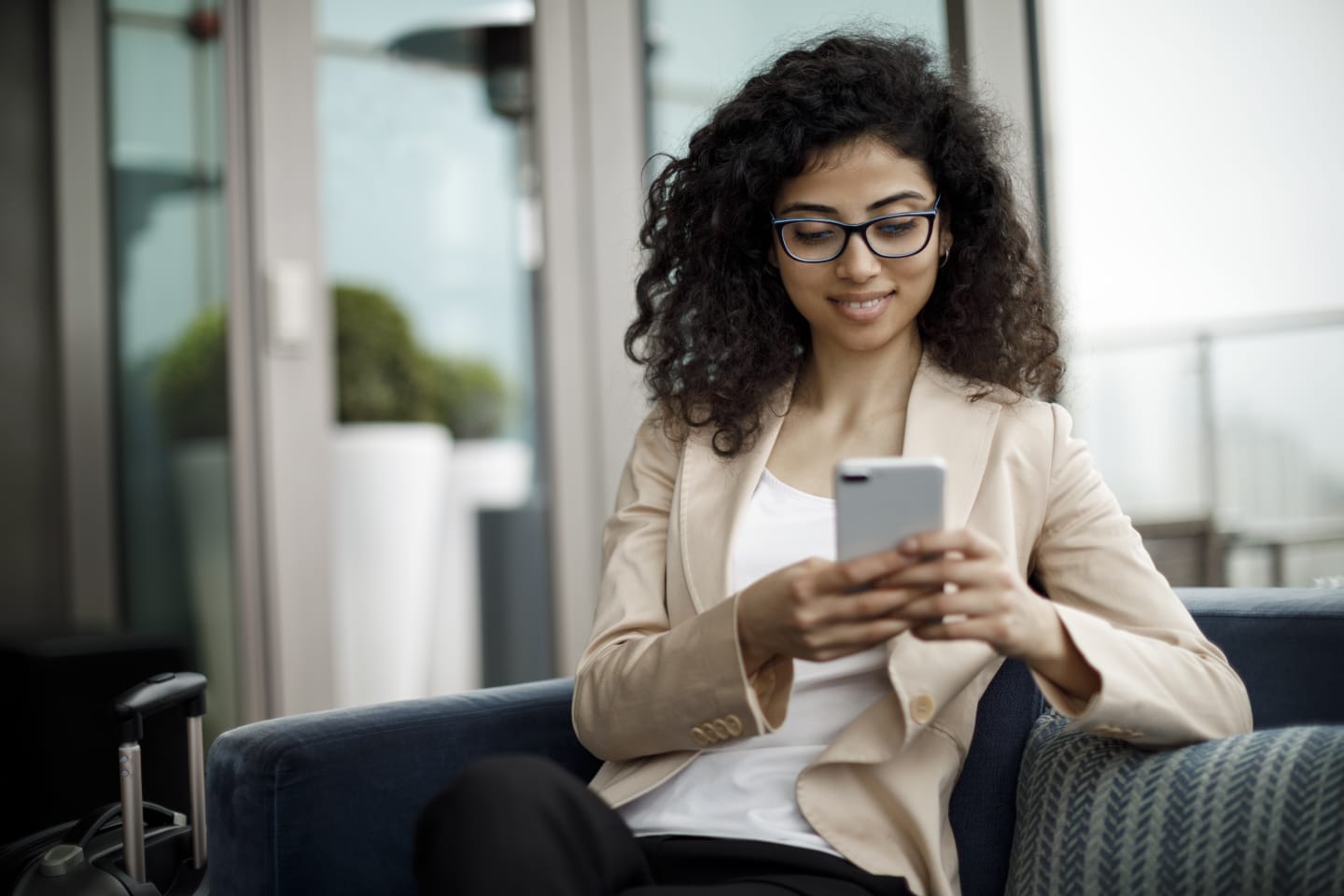 Woman on the phone using the Navan mobile app.