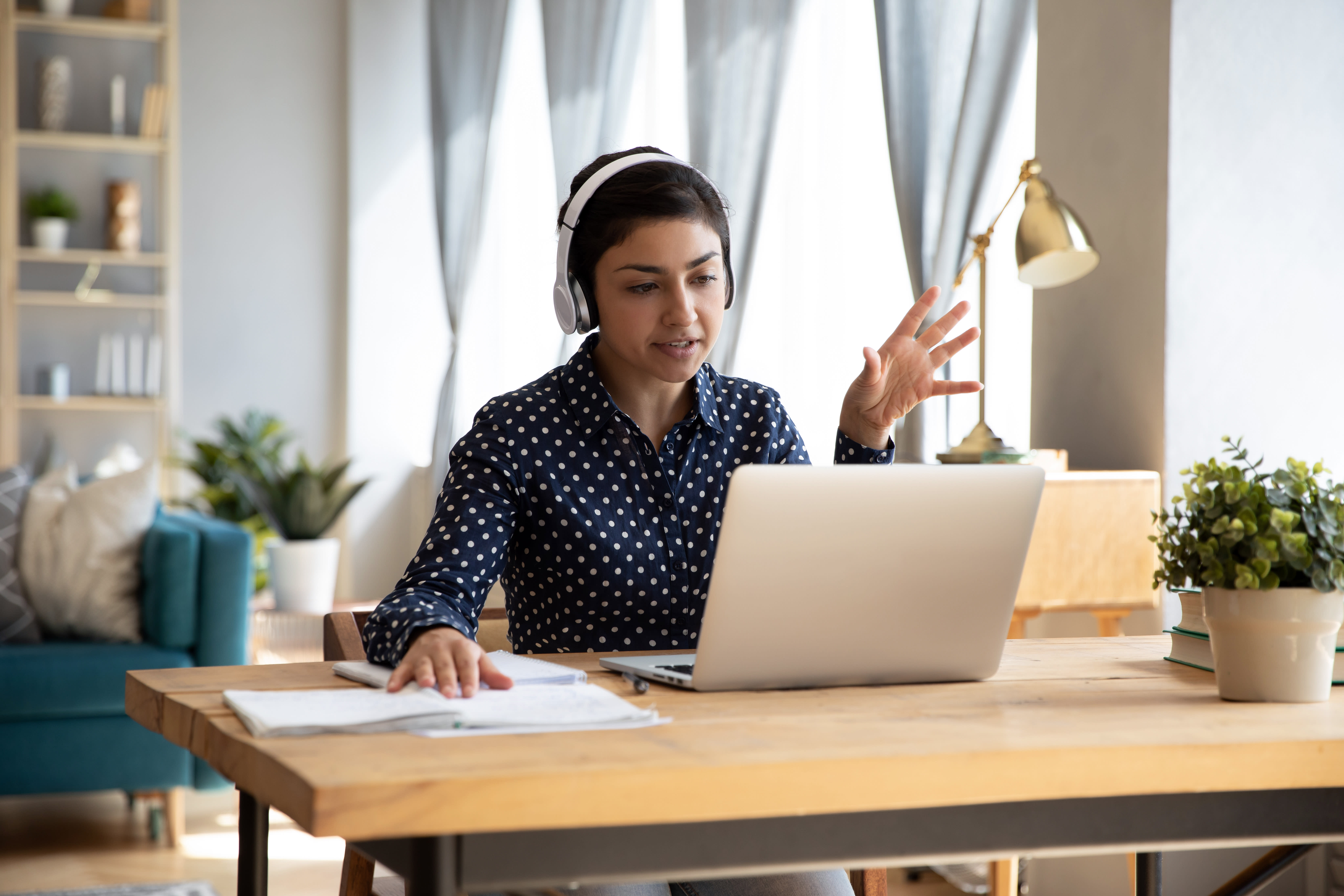 person working from home with headphones on