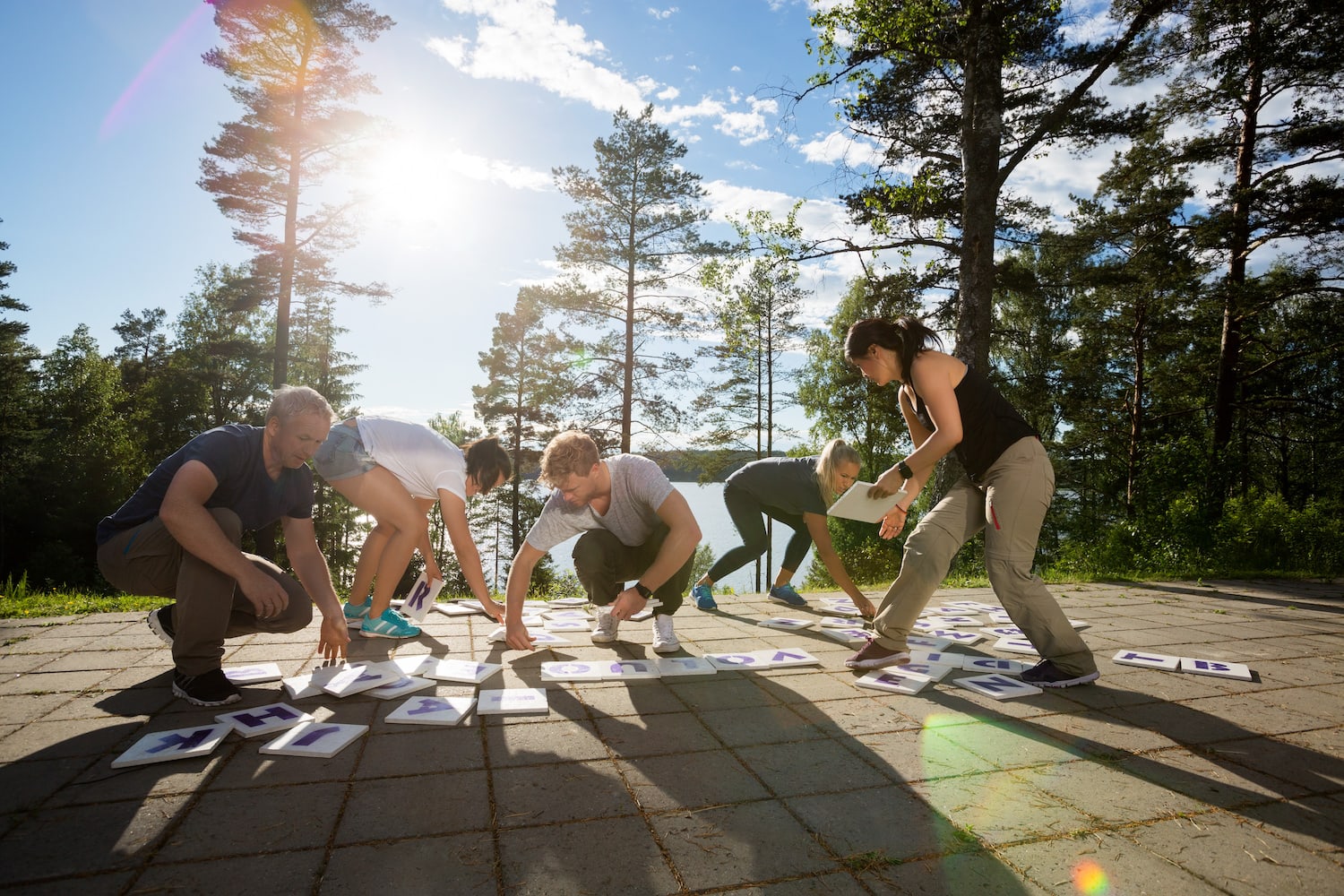 A team participating in an outdoor activity during an offsite.