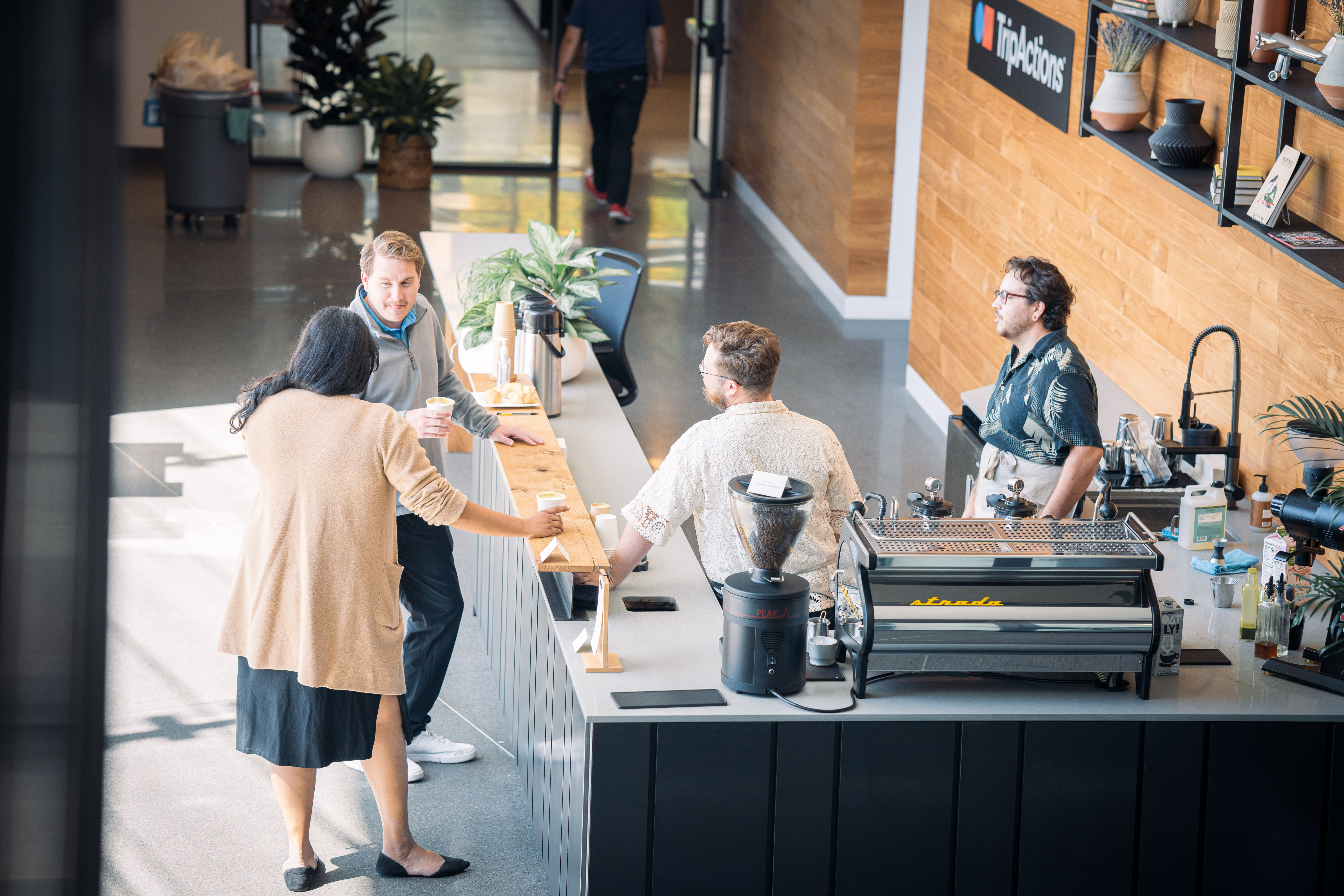 Colleagues grab coffee at the TripActions HQ coffee bar.