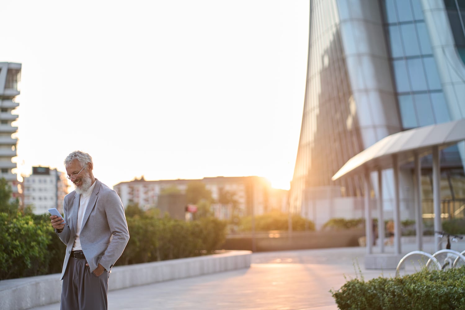 A man checks his corporate travel app on a business trip