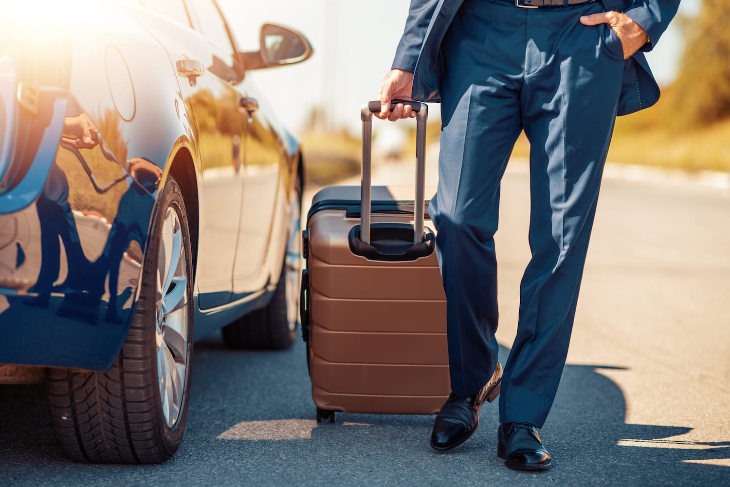 A business traveler picks up his rental car.