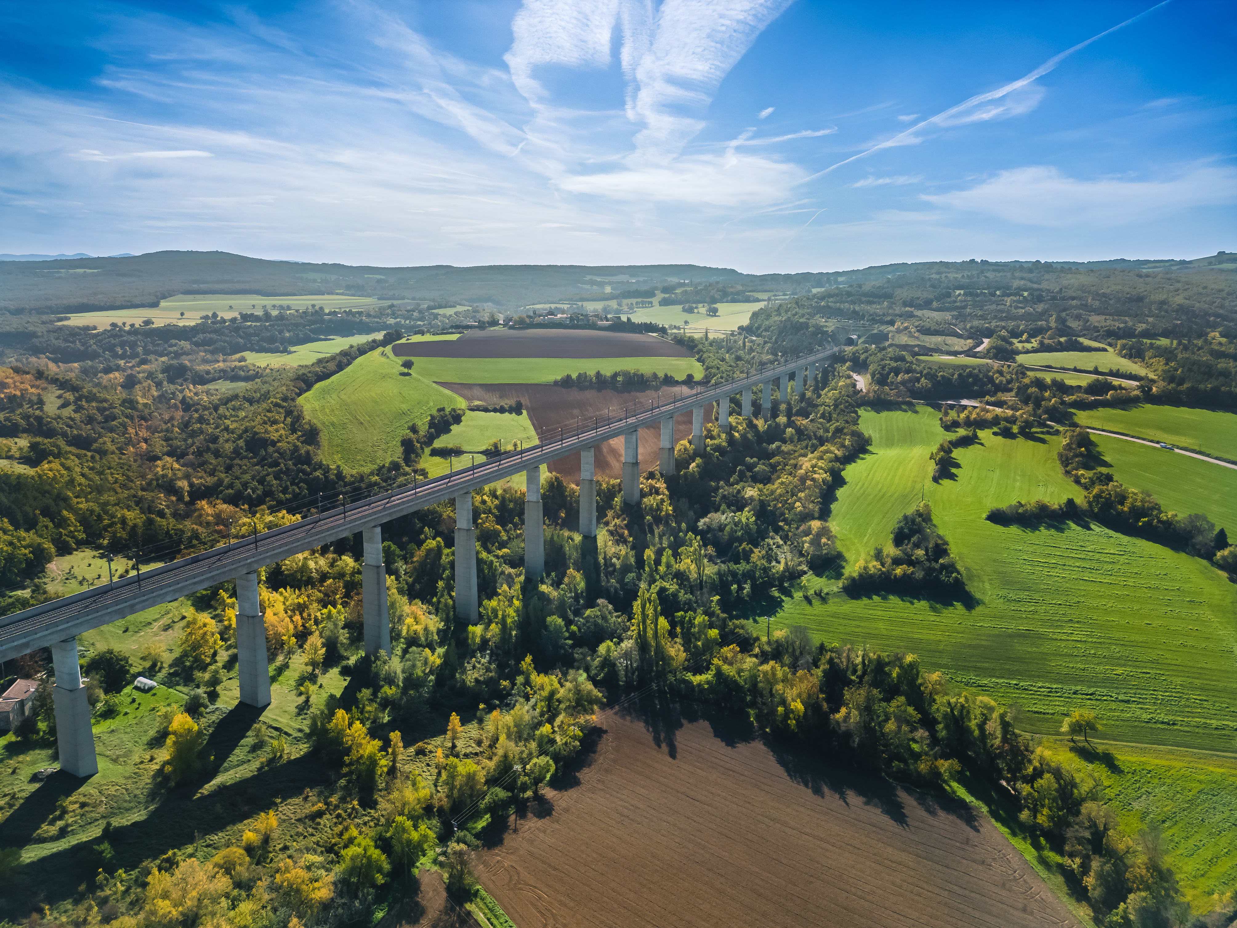 Aerial view of high-speed railroad tracks in the countryside.