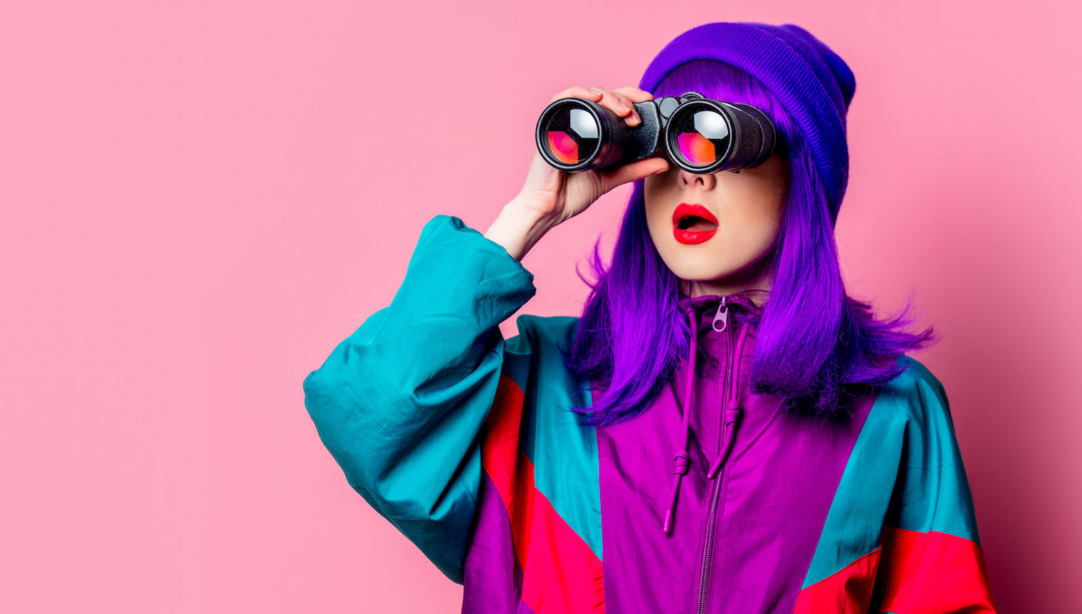 candidate travel booking platform - woman looking through binoculars
