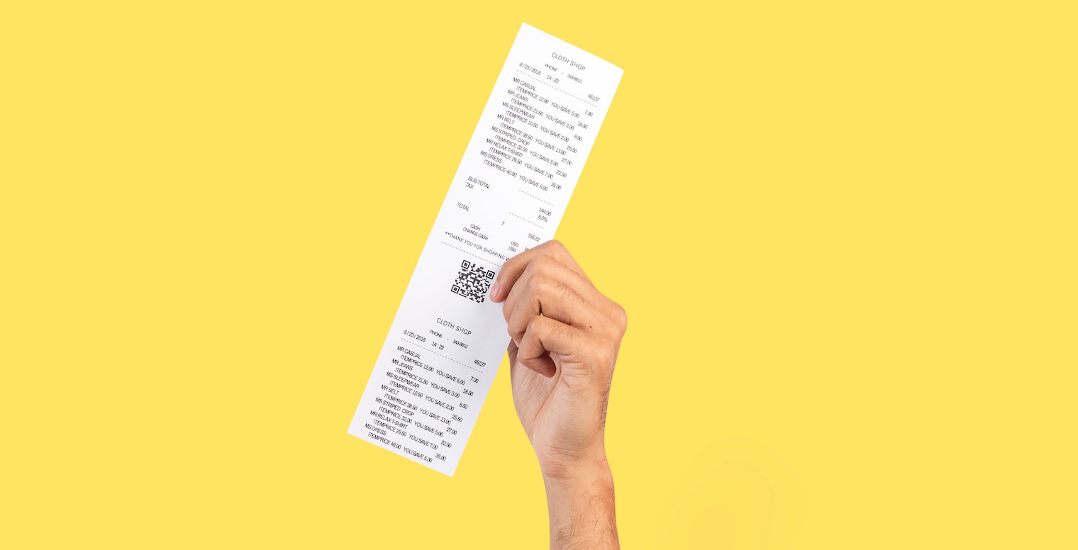 automate business receipt itemization - hand holding receipt