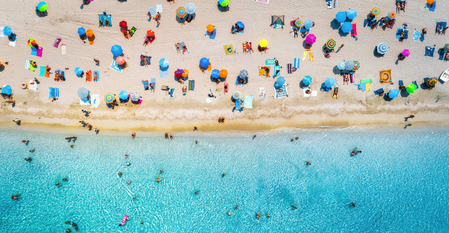 summer travel tips - an aerial view of a beach