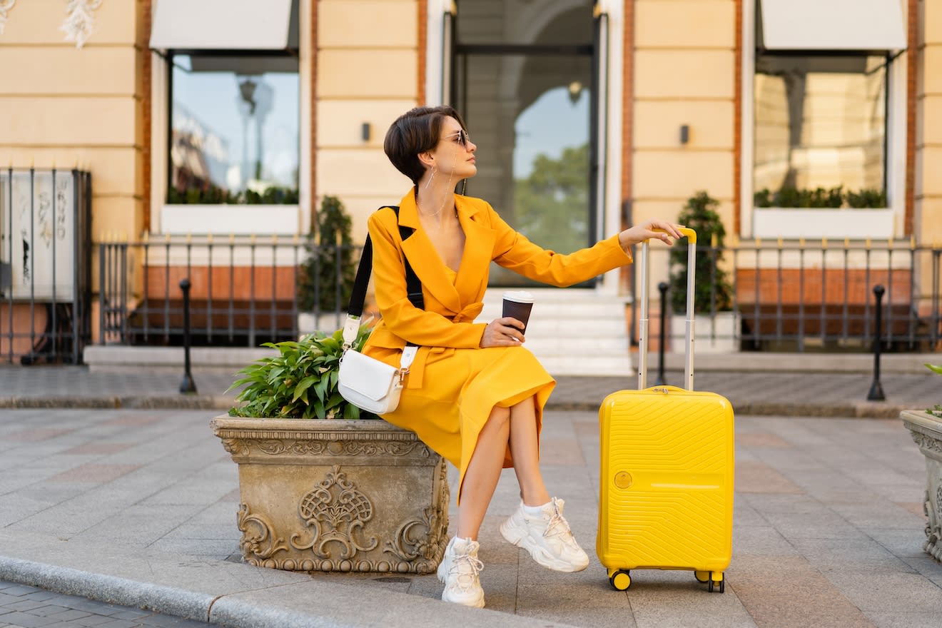 Employee travel expenses: A business traveler rests easy knowing she won't need to complete travel expense reports