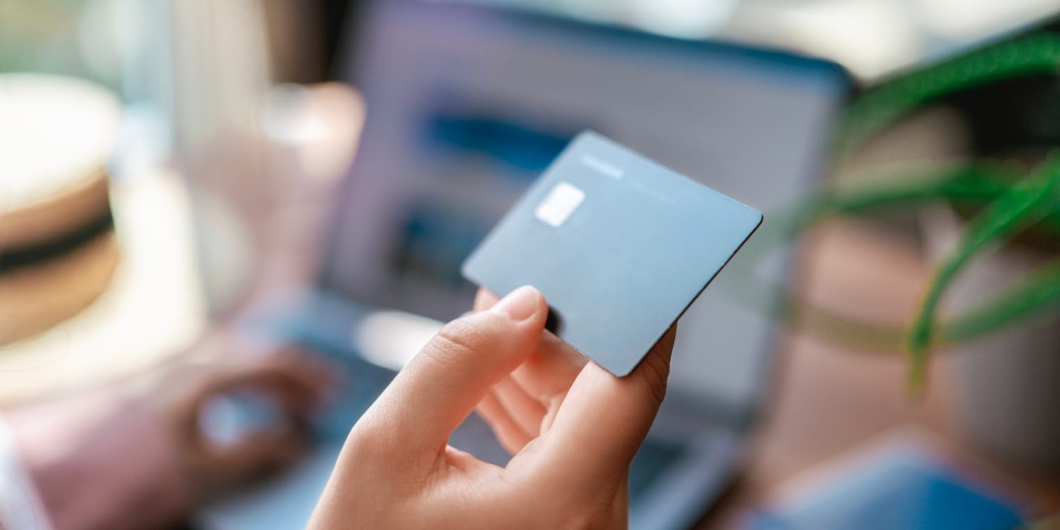 How to Keep Track of Business Expenses. Hand holding a credit card