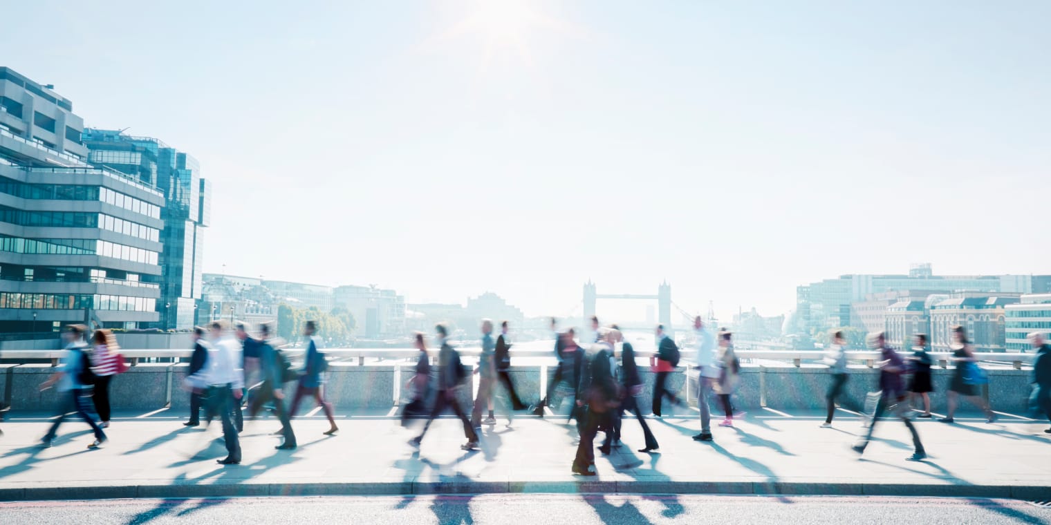 Business travel expenses. People walking on bridge 