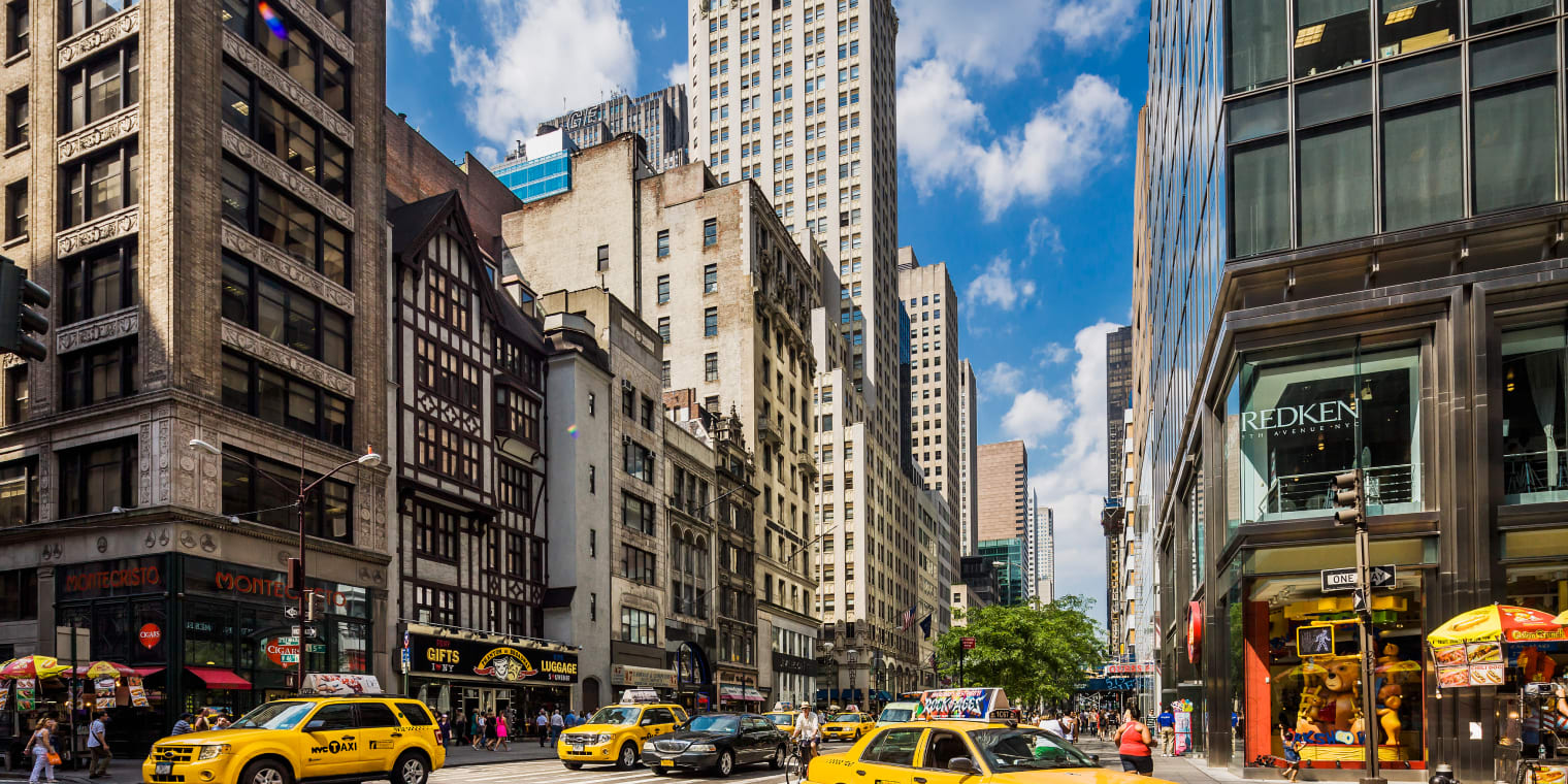 NYC road full of yellow cabs. Business hotel