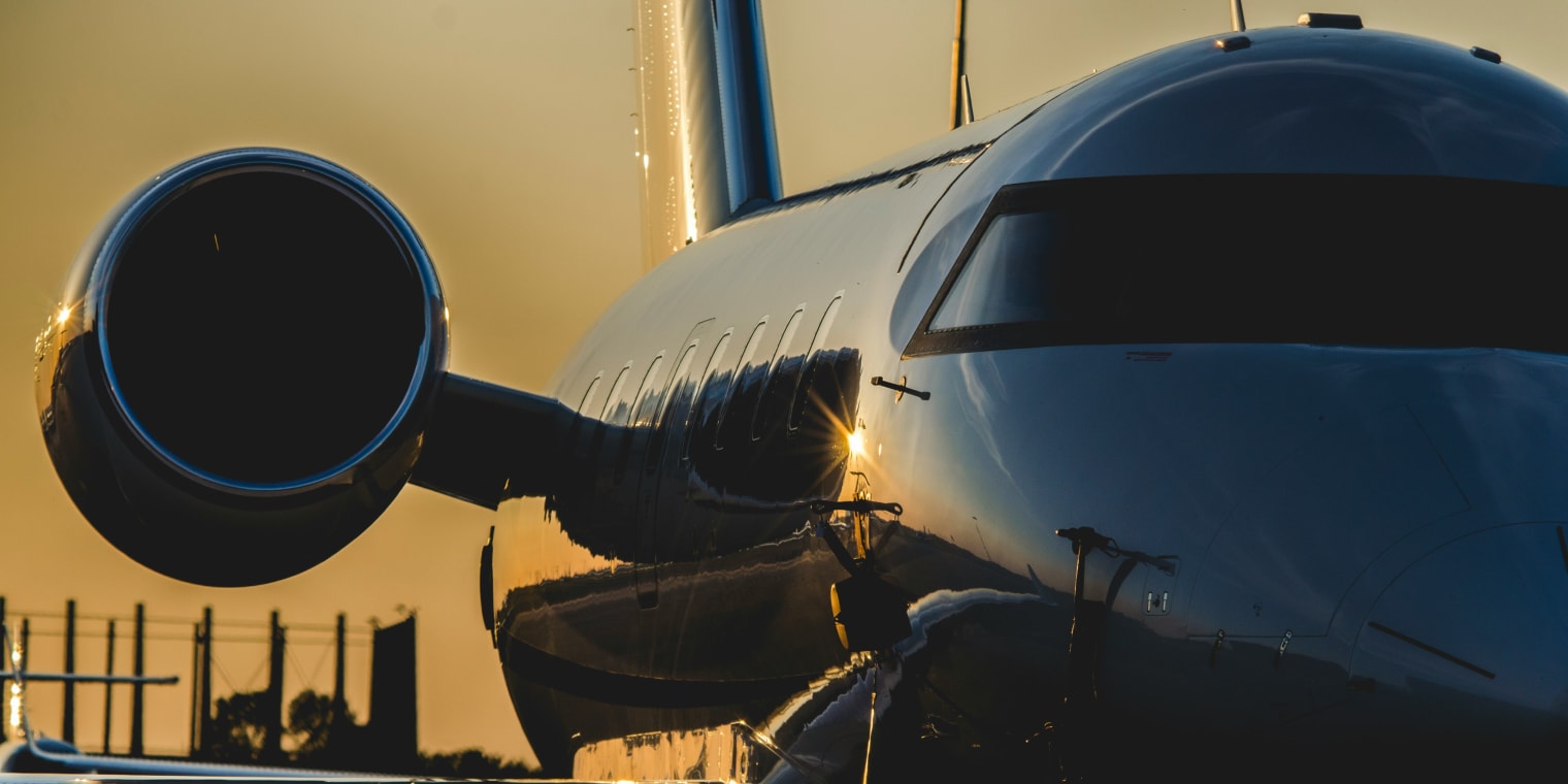 Side of a private plane at sunset. How Much to Rent a Private Jet for a Day