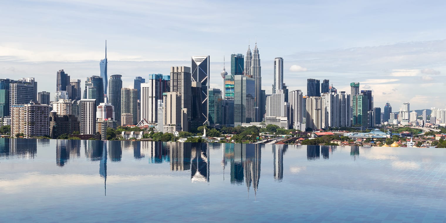 Modern glass skyscrapers reflected in water. Travel tech companies