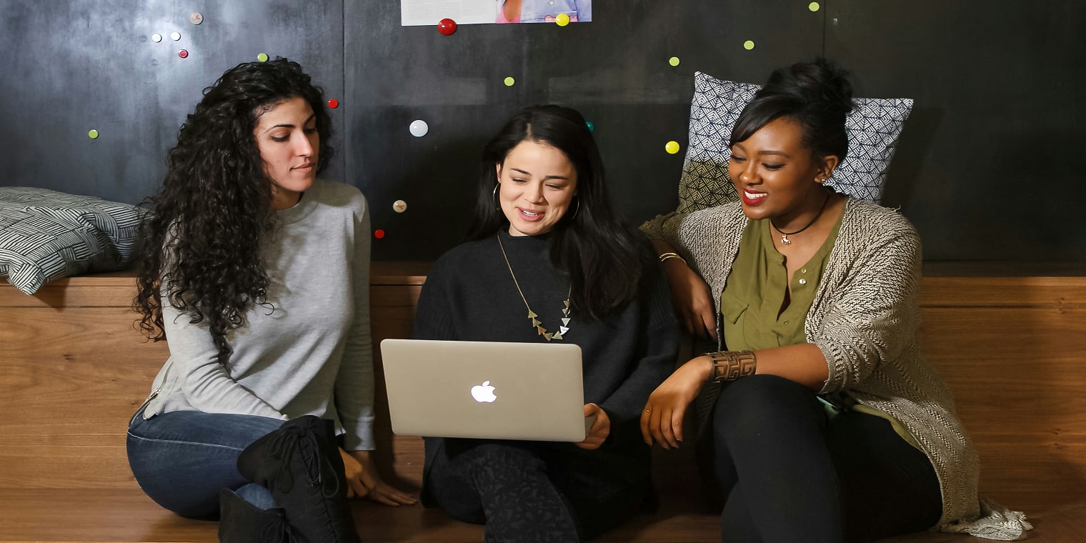 Travel management RFP Three Women Looking at a Computer