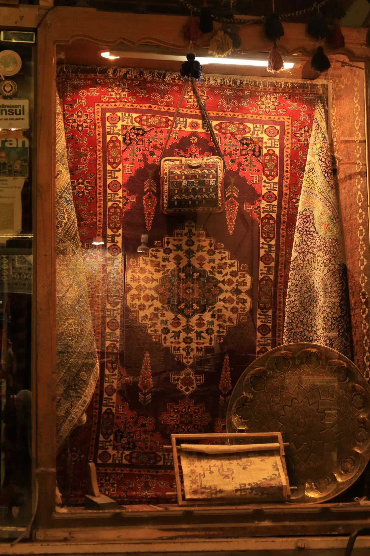 Close-up of Persian carpet weaving showing knot density and natural dye colours
