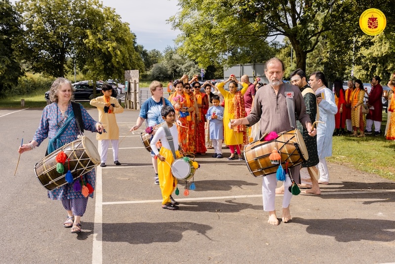 Kalash Yatra procession with dhol drummers at the Grand Opening